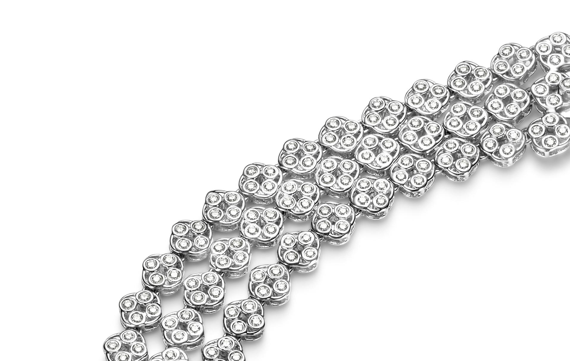Fabulous 18 kt. White Gold 3 Row Tennis Bracelet With 10.57 ct. Round Cut Diamonds

Diamonds: Brilliant cut diamonds, together 10.57 ct. 

Material: 18 kt. white gold

Measurements: 16 cm x 25.5 mm x 3 mm ( can be resized to measure)

Total weight: