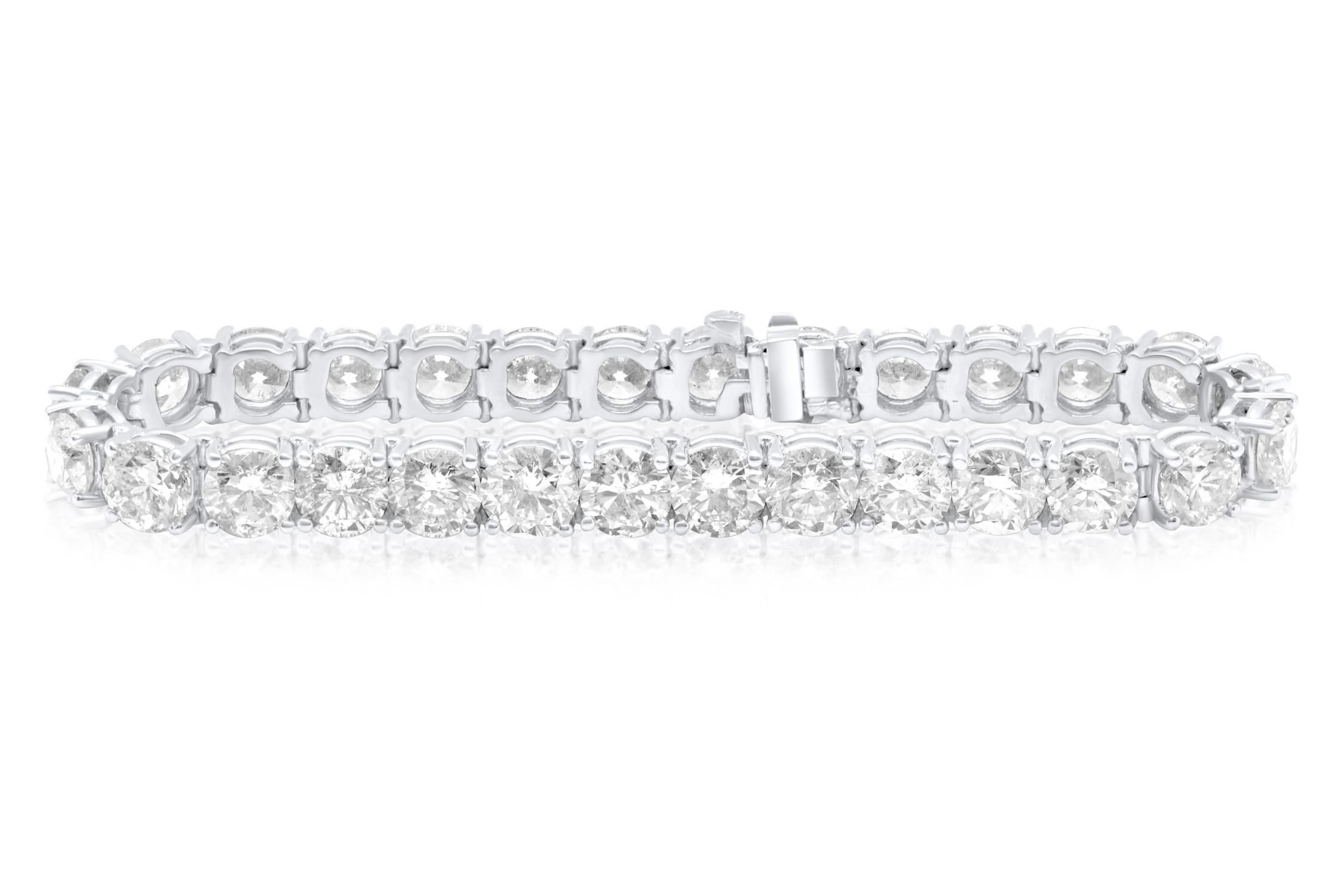 18 kt custom white gold prong diamond tennis bracelet  13.50 cts of round diamonds 0.35 each stone FG color SI clarity.  Excellent Cut.