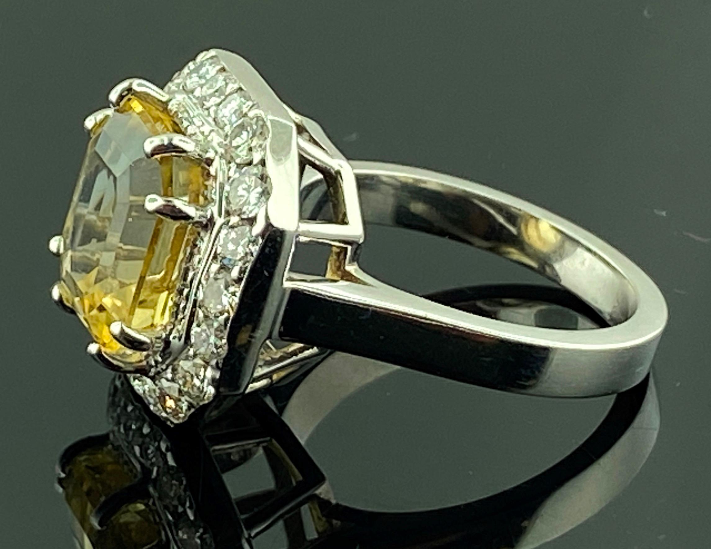 Set in 18 karat white gold is a 4.84 carat rectangular step cut Citrine with 20 round brilliant cut diamonds with a total diamond weight of 0.50 carats.  Color H-I, Clarity SI.  Ring size is 6.