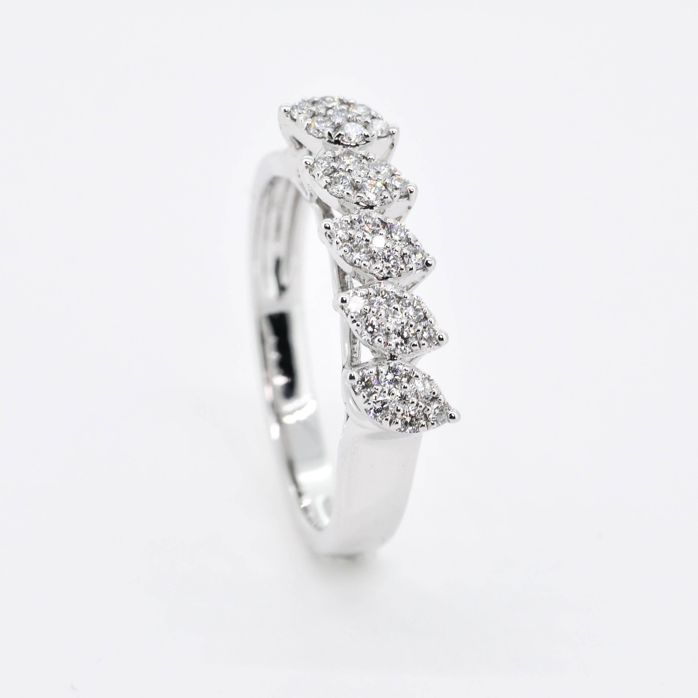  Incredibly glamorous and luxurious, this ring is filled with a cluster of round brilliant diamonds to form the marquise shapes and gives the illusion of 5 large diamonds. Filled with breathtaking sparkle, this white gold diamond marquise cluster