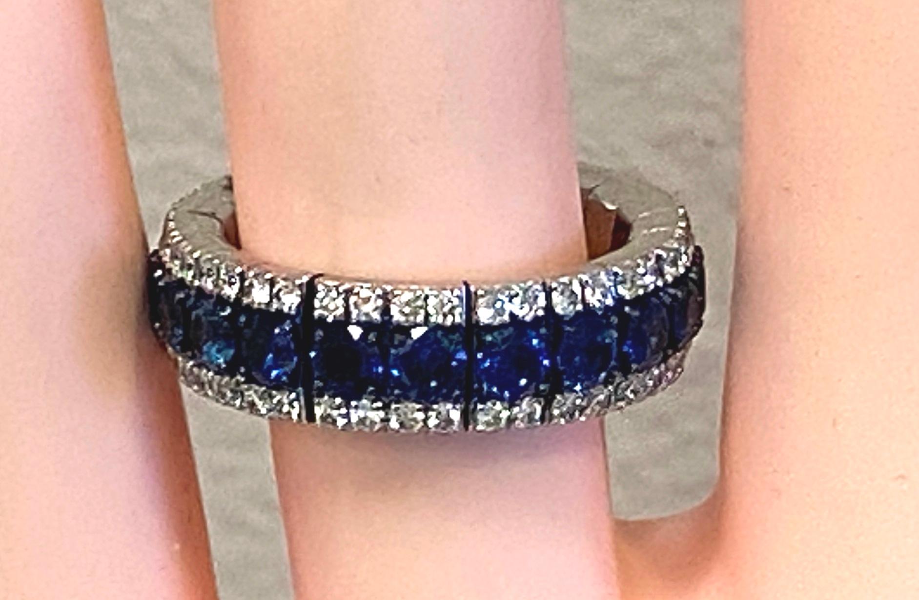 Set in 18 karat white gold  are 21 round cut Blue Sapphires with a total weight of 2.84 carats with 84 round brilliant cut diamonds with a total weight of 0.94 carats.  This band is expandable and stackable.  Ring size is 7.  Gold weight is 9.15