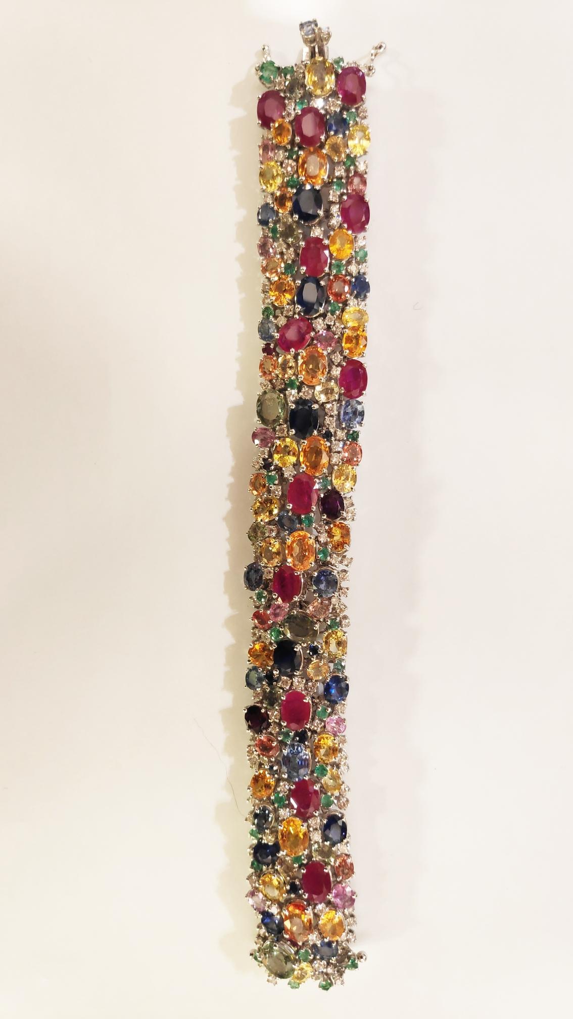 18 kt white gold bracelet, multi-colored sapphires, diamonds, emeralds and rubies, total color stones 108 ct and total brilliants ct 8.50
