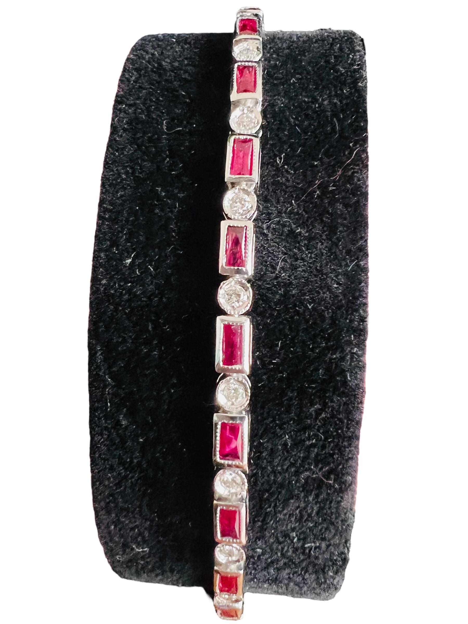 18 kt white gold bracelet set with diamonds and rubies
clasp with safety in 18 ct gold
total weight: 9.20gr
ruby: 13.67 ct
diamonds: 0.30 ct