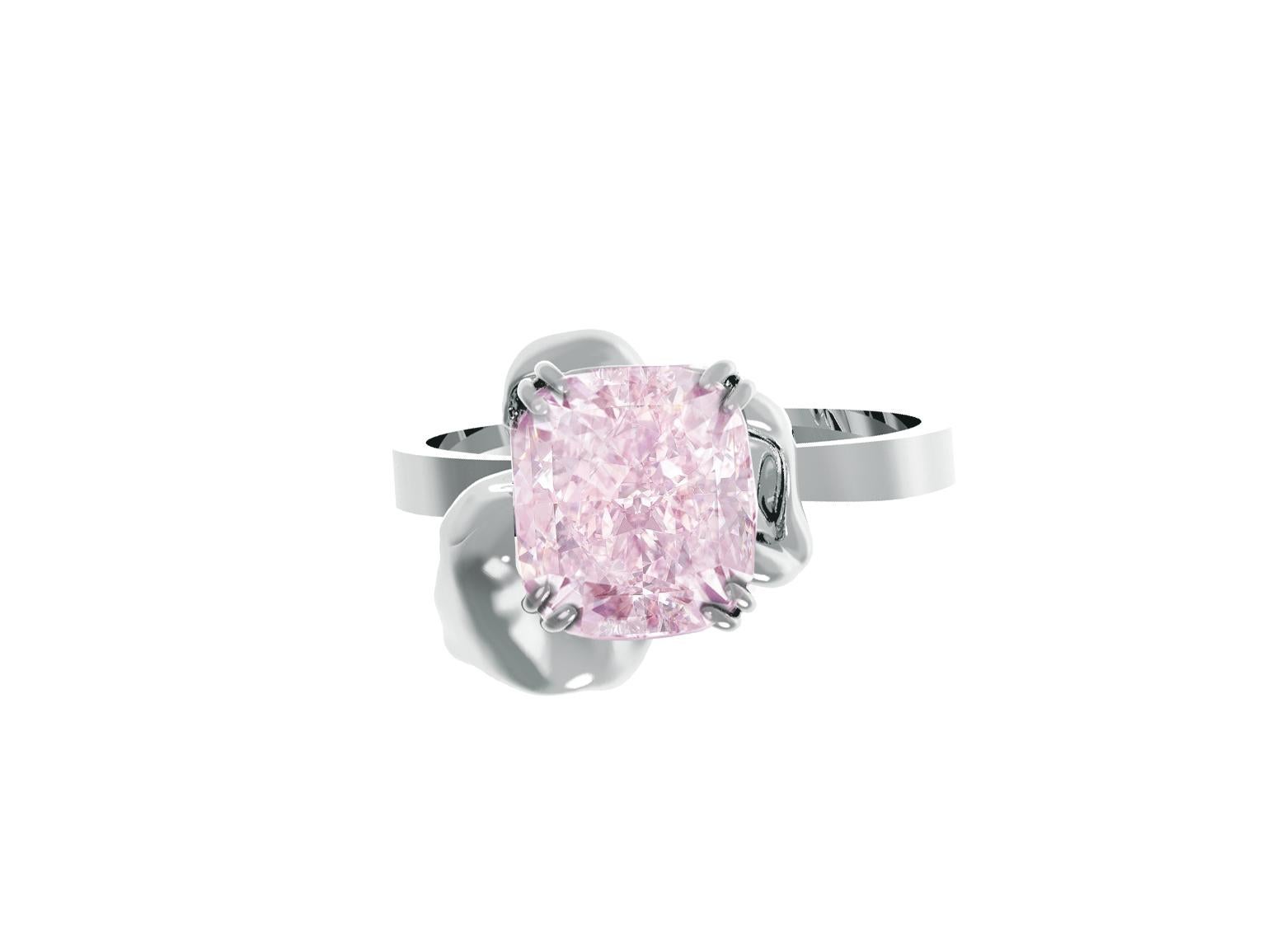 This contemporary Bridal Buttercup ring is a true work of art designed by oil painter Polya Medvedeva. The ring is crafted in 18 karat white gold and features a stunning GIA certified 0.8 carat fancy light purplish pink diamond with exceptional