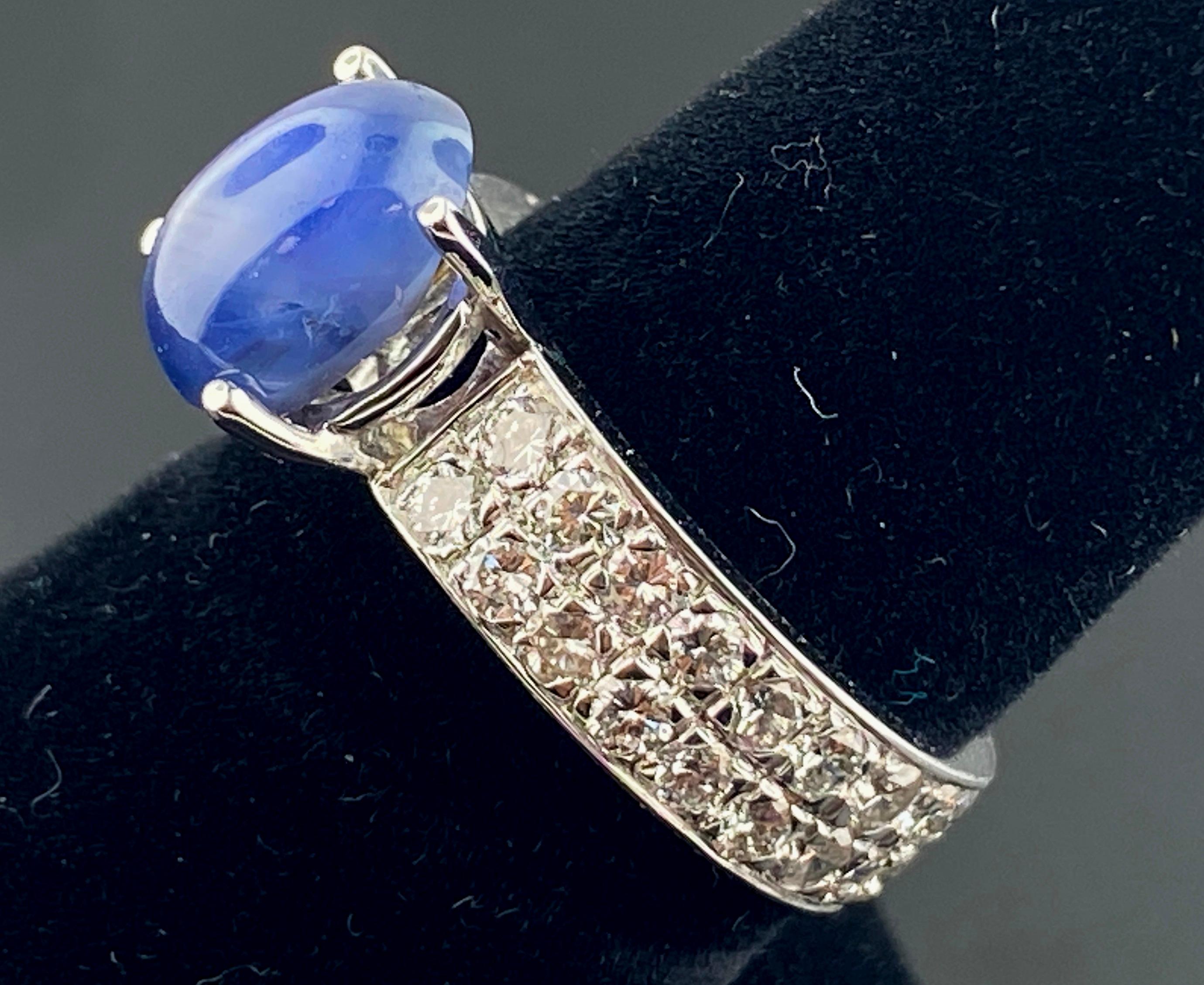 Set in 18 karat white gold is a 3.71 carat Blue Star Sapphire with 48 round brilliant cut diamonds in the mounting with a total diamond weight of 1.50 carats. Color is H, Clarity is VS. Ring size is 6.50.