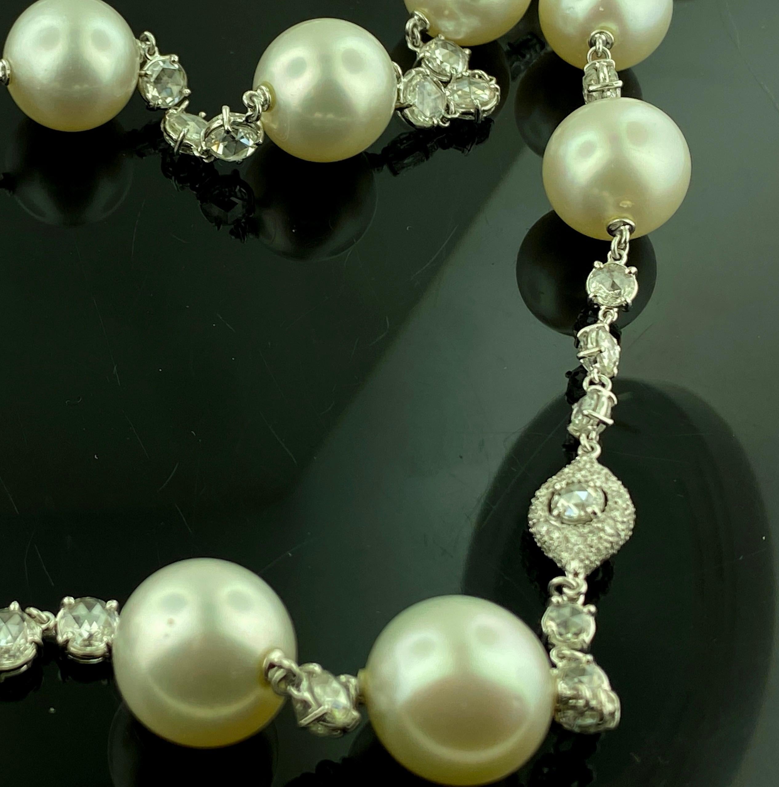 Set in 18 karat white gold are 25 South Sea Pearls plus 32.51 carats of Rose Cut diamonds and 3.37 carats of full cut diamonds.  Total diamond weight is 35.88 carats.  Length is 22