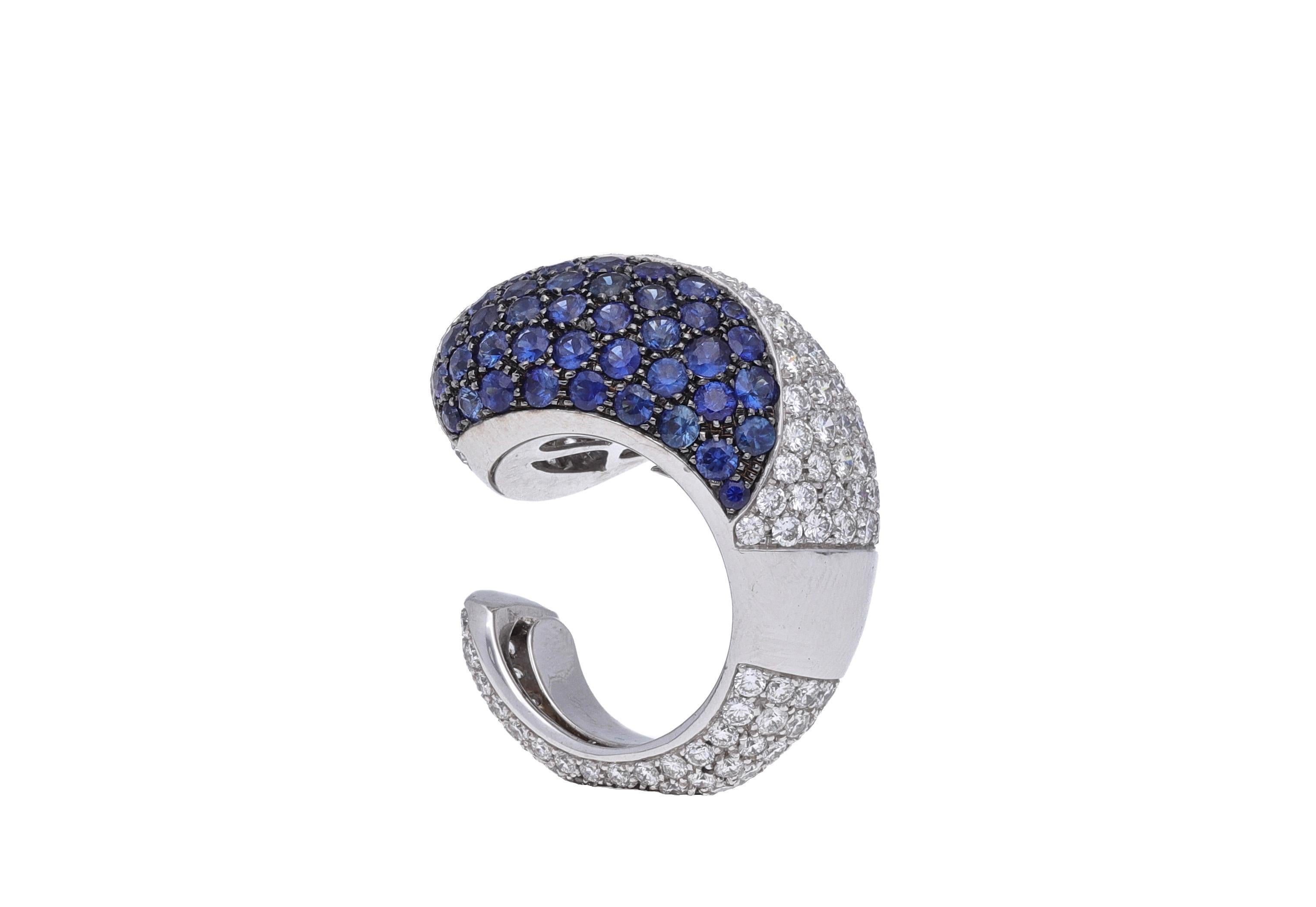 18 Kt. white gold cocktail ring with round-cut diamonds and round-cut blue sapphires.
This beautiful ring is hand made in Italy and is one of a kind piece.
The ring is signed by Fraleoni, Italian jewelry brand.

Diamonds: 7.06 carats ( H-I color /