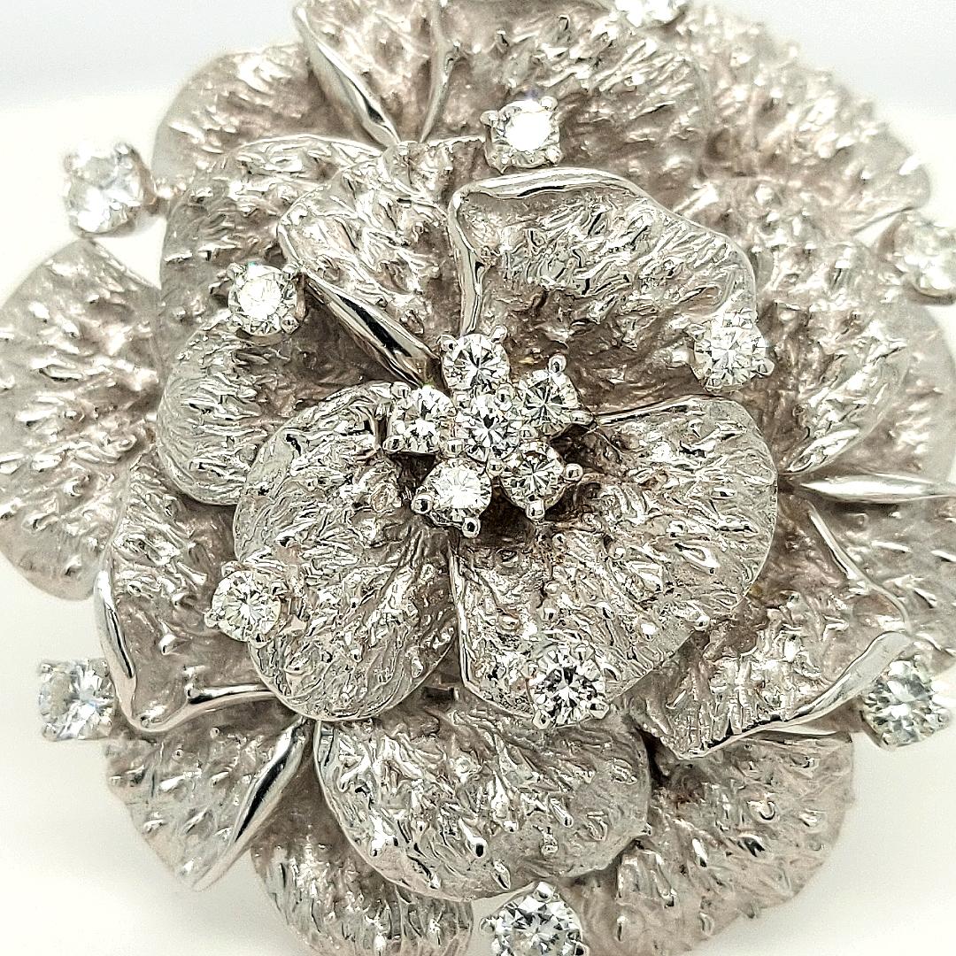 18Kt White Gold Diamond Camellia Flower Brooch

Diamonds: 17 diamonds : 1,82 ct D/E color and IF/VVS Clarity

Material: 18kt white gold

Total weight: 28.3 gram

Measurements: Length 42.6 x Height 42.4 x depth 14 mm
