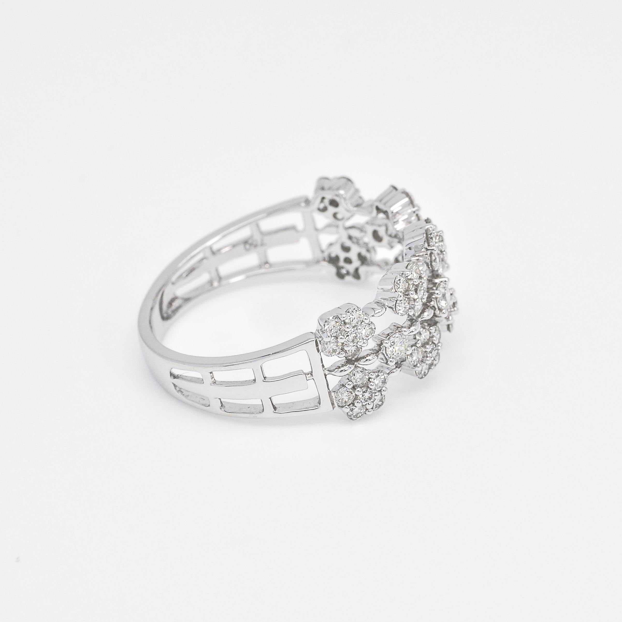 The 18KT White Gold Diamond Multi Cluster Ring is a breathtaking piece of jewelry, perfect for those special moments in life. With its beautiful diamond clusters, this ring showcases an art deco style that adds an extra touch of elegance. Its 18KT