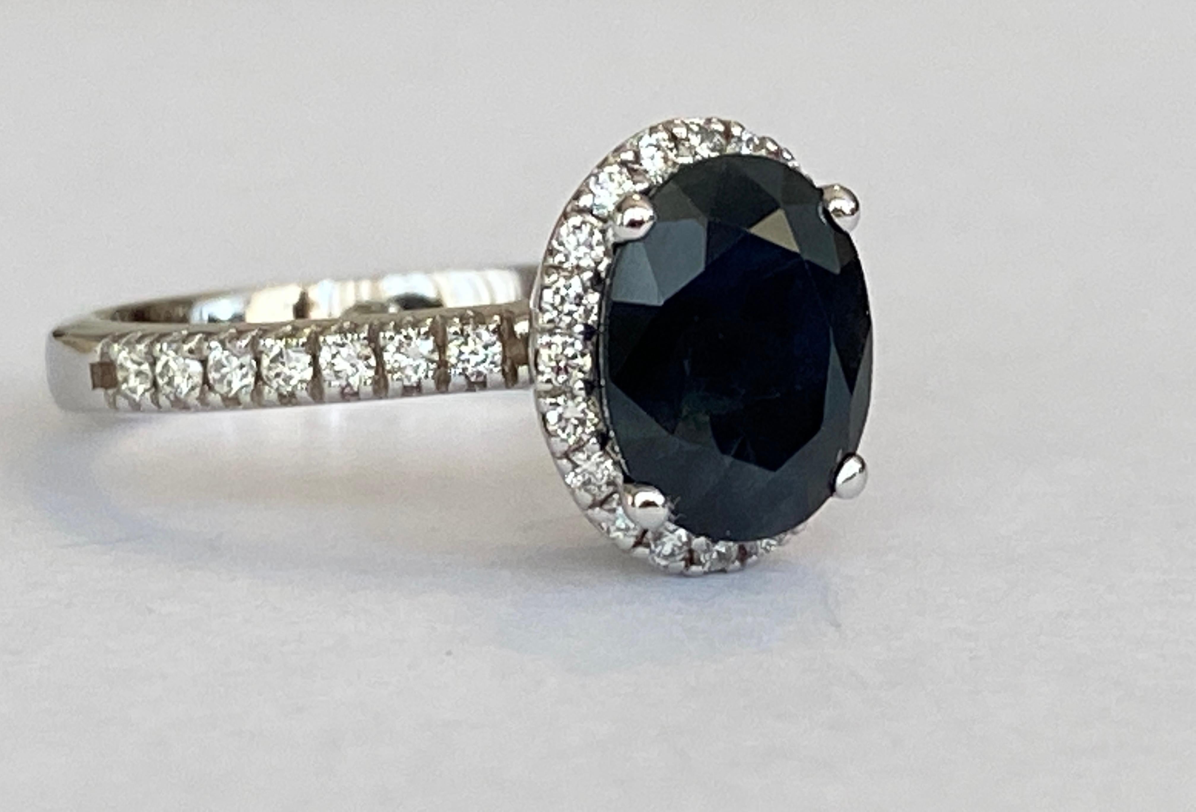 A breathtaking 18kt white gold Diana cocktail ring featuring a stunning 2.70-carat sapphire at its center, surrounded by 34 dazzling halo of brilliant diamonds. Inspired by timeless elegance, this exquisite design highlights the dark blue allure of