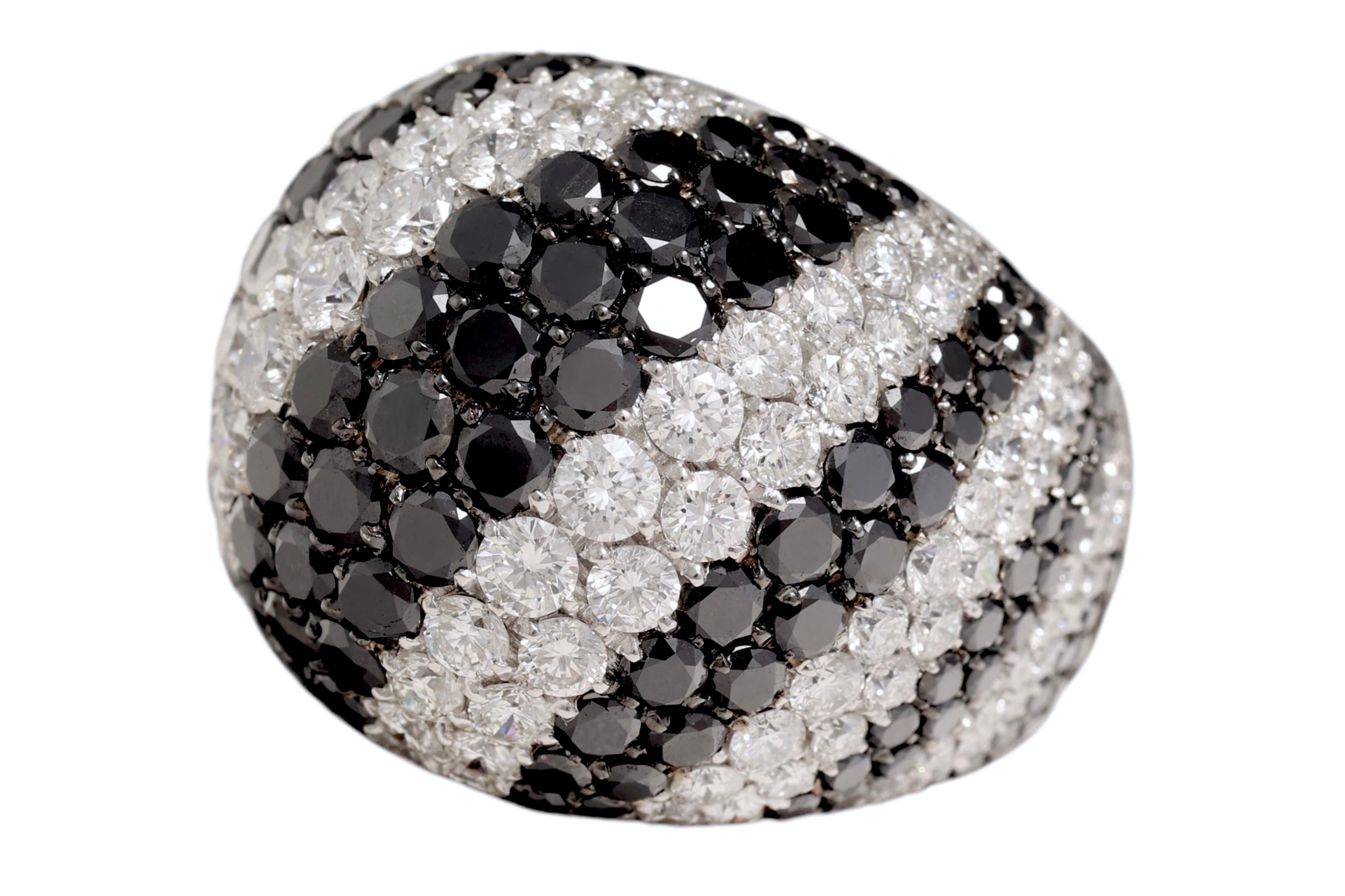 18 KT RING WHITE GOLD WITH  BLACK & WHITE DIAMONDS, Amazing Piece of Art.

MATERIAL: 18 kt solid white gold

DIAMONDS: white brilliant cut diamonds (together ca. 4.80 Cts F/G VS , black diamonds (together ca. 5.76 Cts)

WEIGHT: 27.6 gram

Size : 54