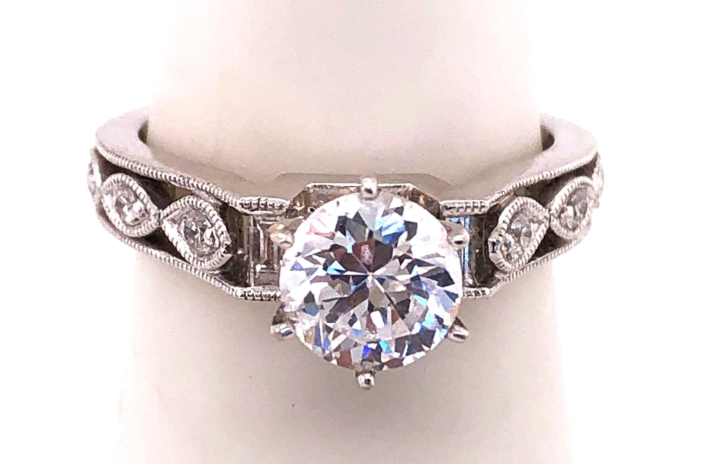 18 Kt White Gold Engagement Bridal Ring With Zircon Center Stone. 0.25 Total Diamond Weight.
Size 6.5 
4.28 grams total weight.