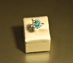 18 kt white gold engagement ring with solitaire emerald oval cut and diamonds