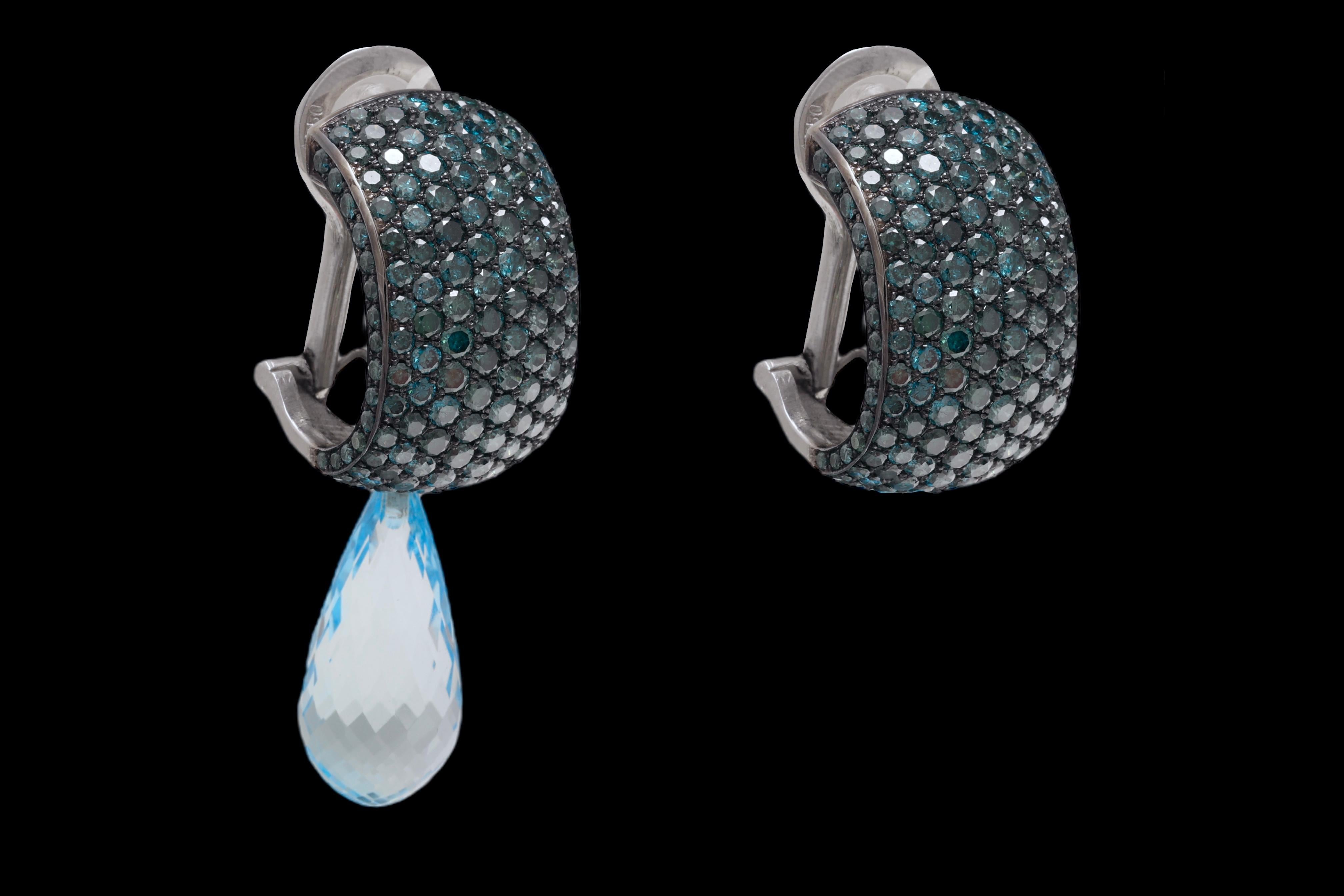 18 Kt White Gold Enhanced 5.76 Ct Ocean Blue Diamond Clip Earrings & Changable Blue Topaze Pendent Briolette Cut Stones

Size : 22 mm length, 13.4mm wide

Enhanced Ocean Blue Diamonds : 5.76 Ct

Changable Pendents Available : comes with Blue