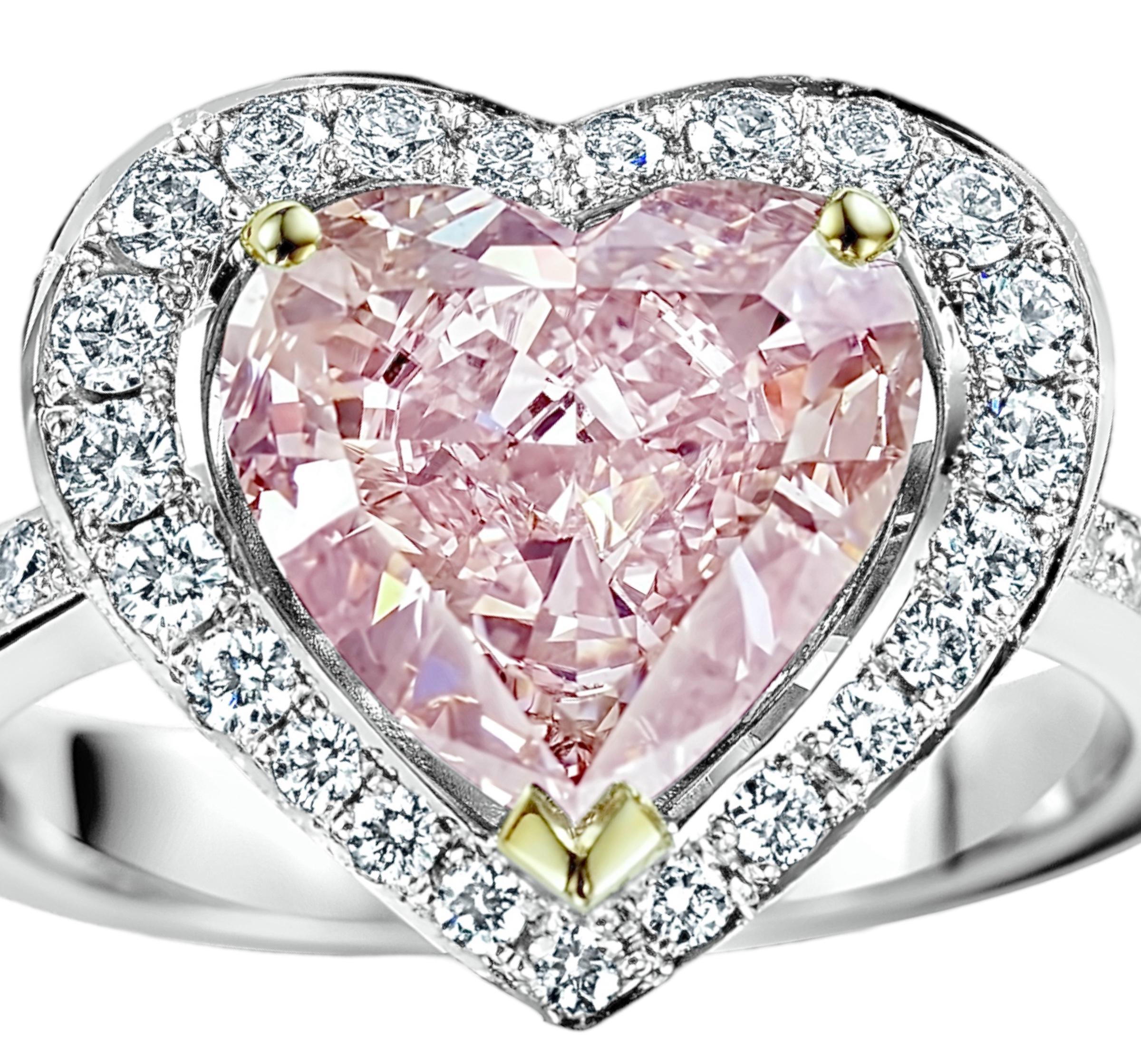 Magnificant Colmpletely Hand Made 18 kt. White Gold Enhanced Pinkish Heart 2.78 ct. Diamond Ring

Heart modified brilliant, Fancy  pink enhanced diamond , 2.78 ct. VVS1
Comes with GIA certificate 

Brilliant cut diamonds together approx. 0.78