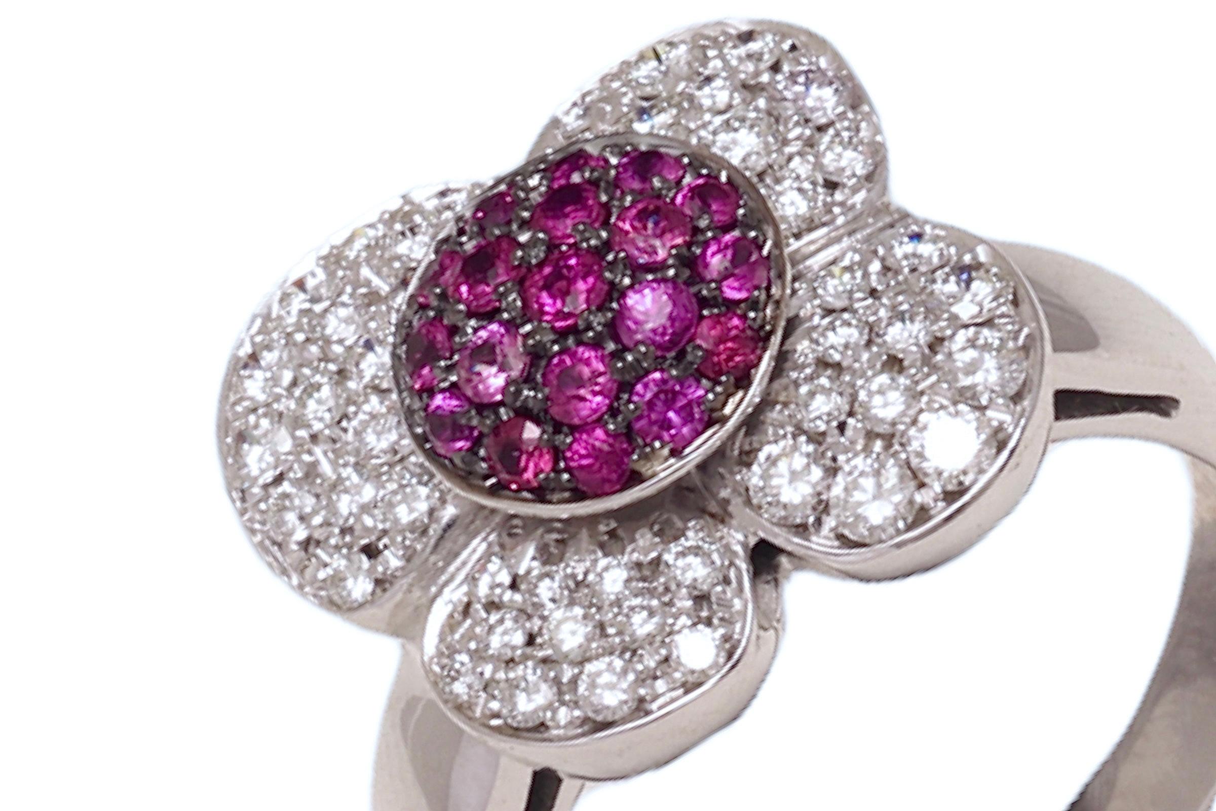 Gorgeous 18 kt. White Gold Flower Shape Ring with 1 ct. Diamonds and 0.5 ct. Pink Sapphire 

Diamonds: 1 ct. brilliant cut diamonds

Sapphires: 0.5 ct. Pink Sapphires

Material: 18 kt. white gold + black rhodium 

Ring size: 54.5 EU / 7 US, can be