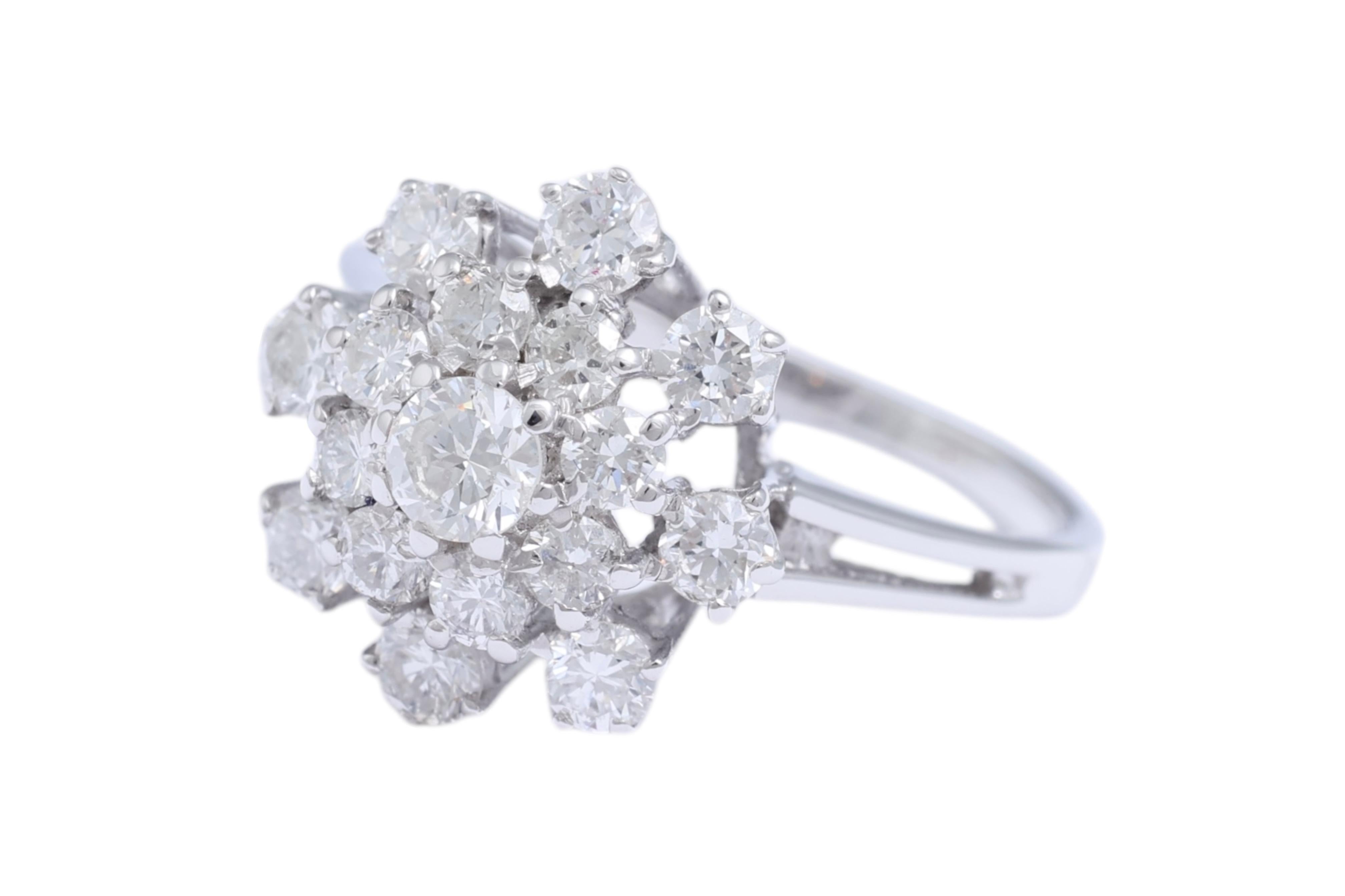 18 Kt White Gold Flower Shaped Ring with Diamonds 

MATERIAL: 18 kt white gold

SIZE: 53 ( size can be changed for free)

WEIGHT: 3.8 grams / 2.4 dwt 

DIAMONDS: brilliant cut diamonds, together ca. 1.48 cts