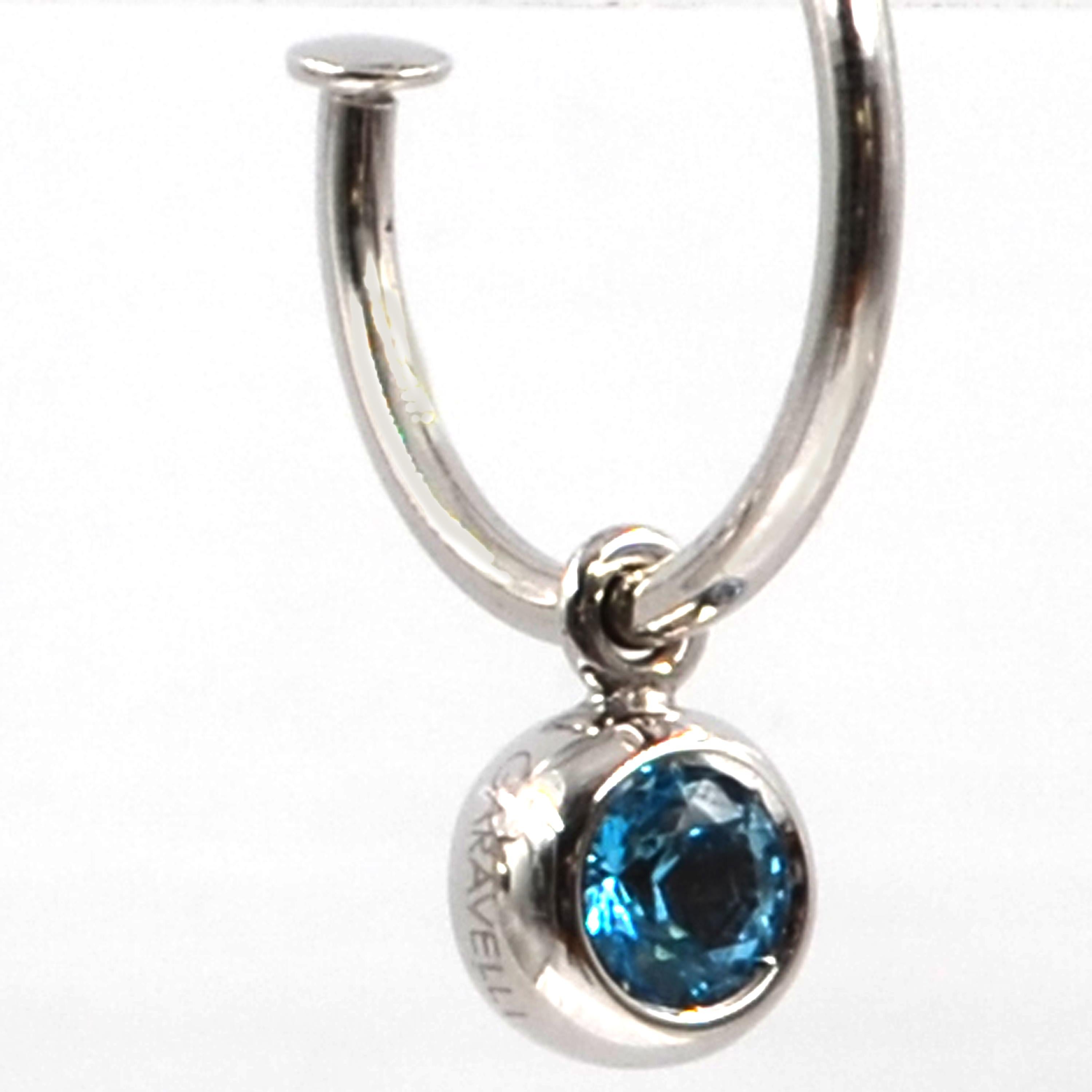 18kt White Gold Blue Topaz  Dangling Hoop Earrings   
Matching ring  also available.
18KT GOLD  gr :4.90
BLUE TOPAZ ct 1.24