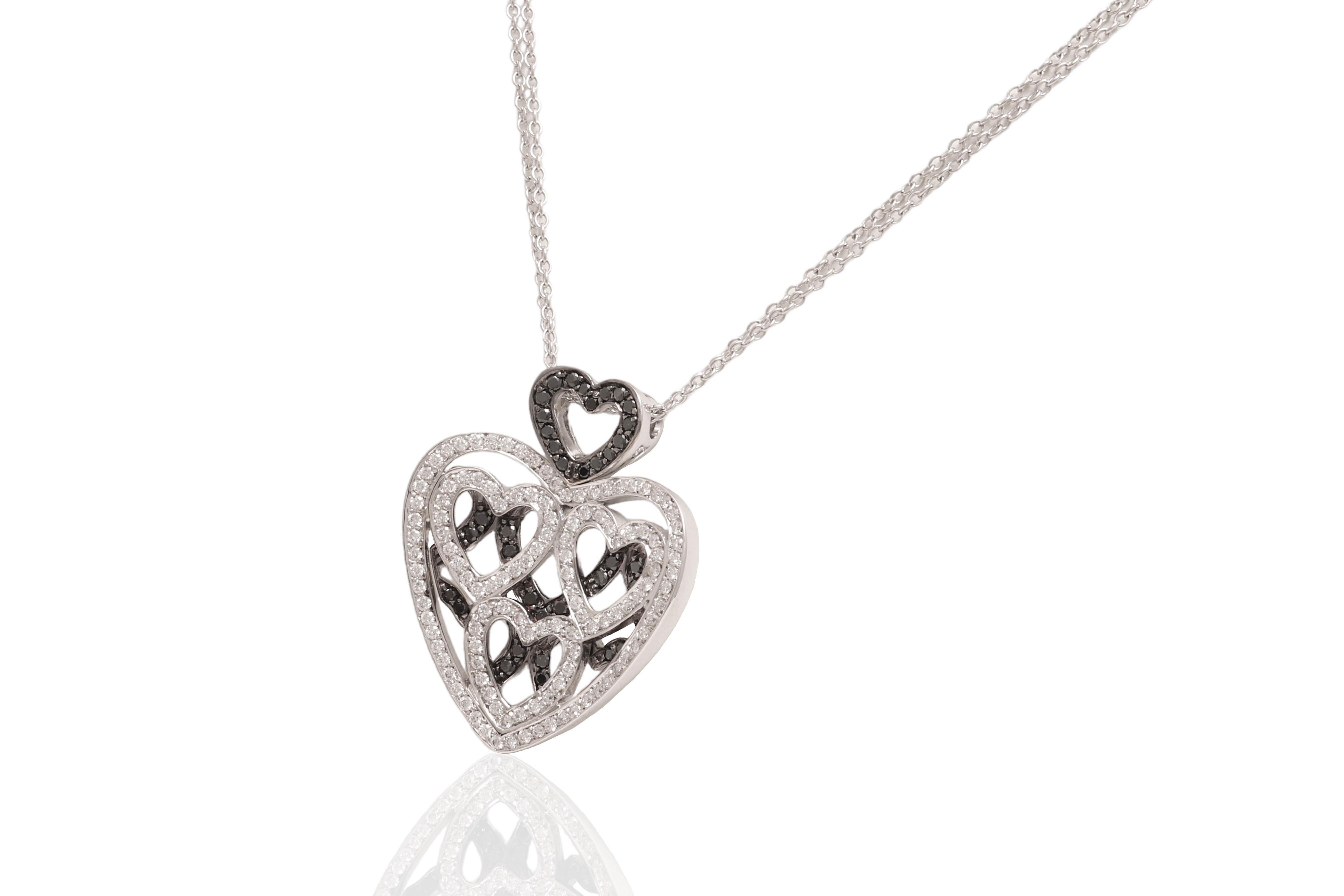 Gorgeous 18 kt. White Gold Heart Necklace With 1 ct. White & Black Diamonds 

A real Piece of Art

Diamonds: White brilliant cut diamonds, together approx. 0.69 ct. 
black diamonds, together approx. 0.31 ct.

Material: 18 kt. Solid white