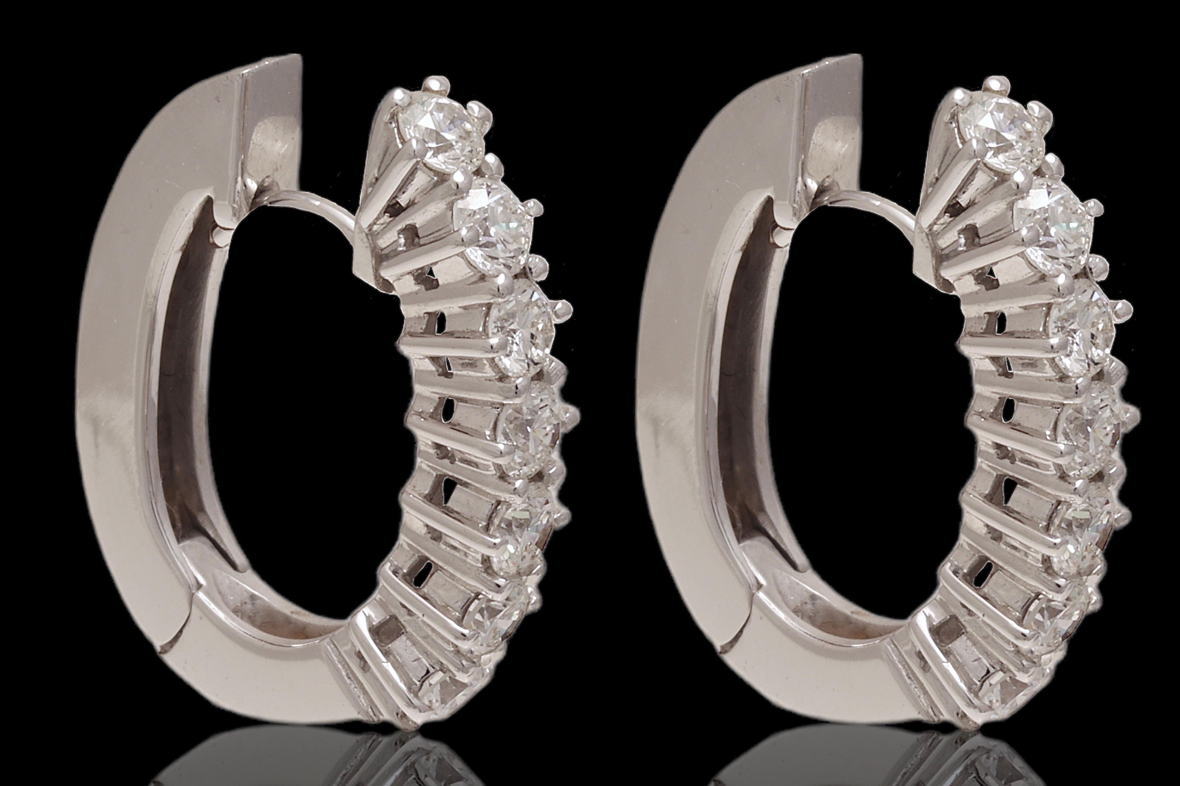 Gorgeous 18 kt. White Gold  Loop Earrings With 1.4ct Brilliant Cut Diamonds

Diamonds: Brilliant cut diamonds together 1.4 ct. GSI

Material : 18kt. white gold

Measurements: 21.5 mm x 17.2 mm x 4.1 mm

Total weight: 8.6 gram / 0.305 oz / 5.5 dwt