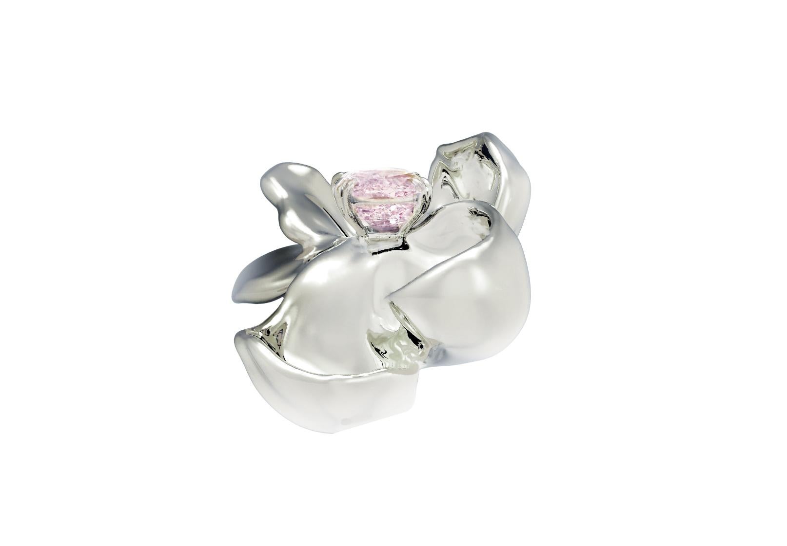 This Magnolia Flower Sculptural brooch is crafted in 18 karat white gold and features a large certified fancy light purplish pink diamond of excellent quality. The crushed ice cushion shape is the artist's favorite for displaying the tender color of