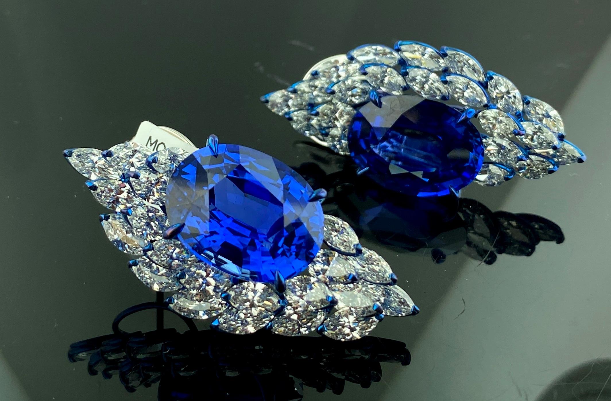 Set in 18 karat white gold are 42 Marquise cut diamonds for a total diamond weight of 13.32 carats with two Oval cut Blue sapphires - 16.68 and 19.41 carats - for a total sapphire weight of 36.09 carats.