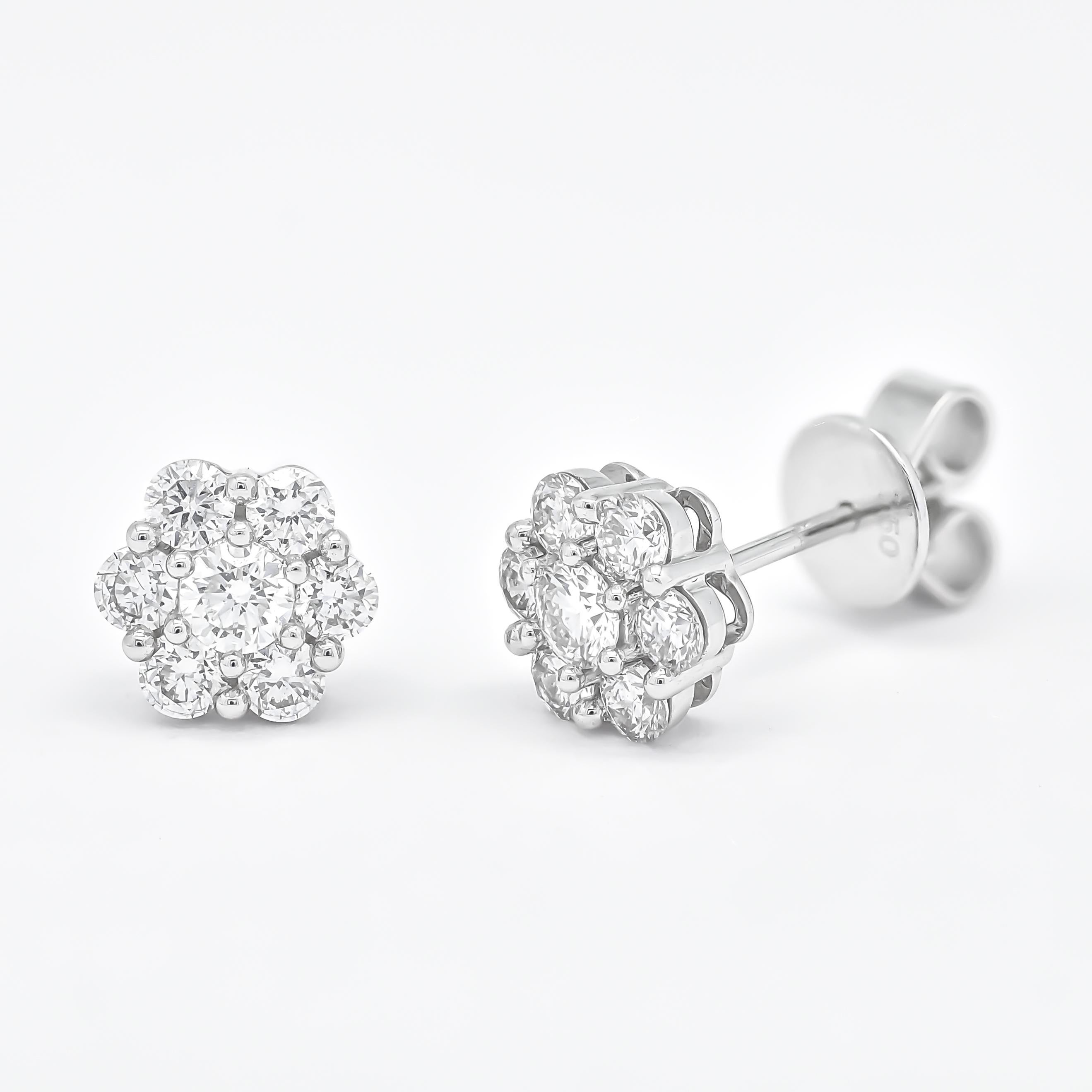 Indulge in the allure of timeless elegance with our exquisite 18kt white gold round diamond flower cluster earrings. Crafted with meticulous attention to detail, these earrings embody the epitome of luxury and sophistication.

Radiating a