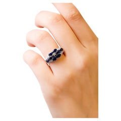 18 Kt White Gold Oval Cut 2.7 Ct Blue Sapphire 0.44 Ct Diamond Floral Band Ring