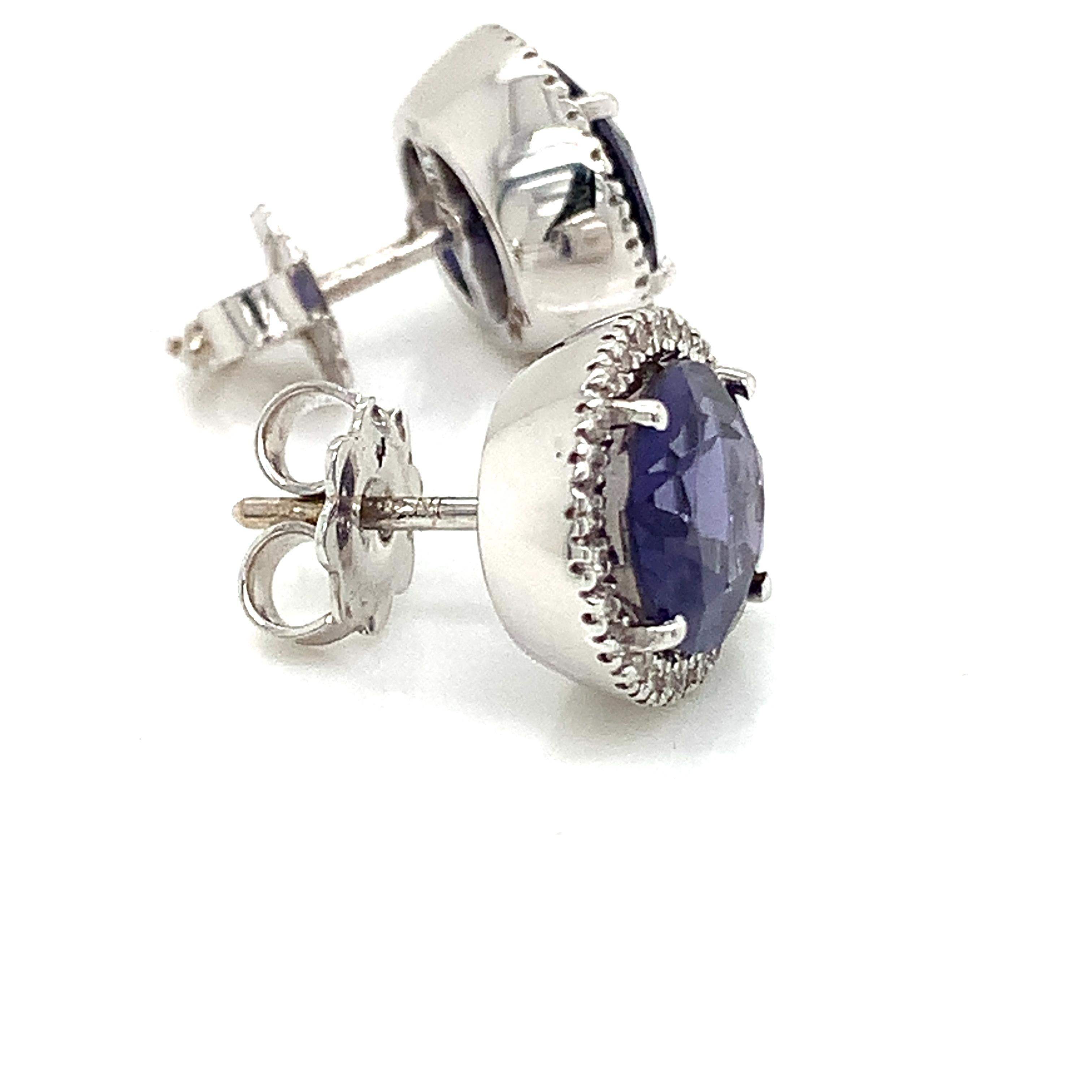 18 Kt White Gold Oval Shape Pair of stud earrings in Iolite and White Diamond by Garavelli  :
Discover timeless elegance with the 18 Kt White Gold Oval Shape earrings in Iolite and White Diamond by Garavelli, a masterpiece of jewelry