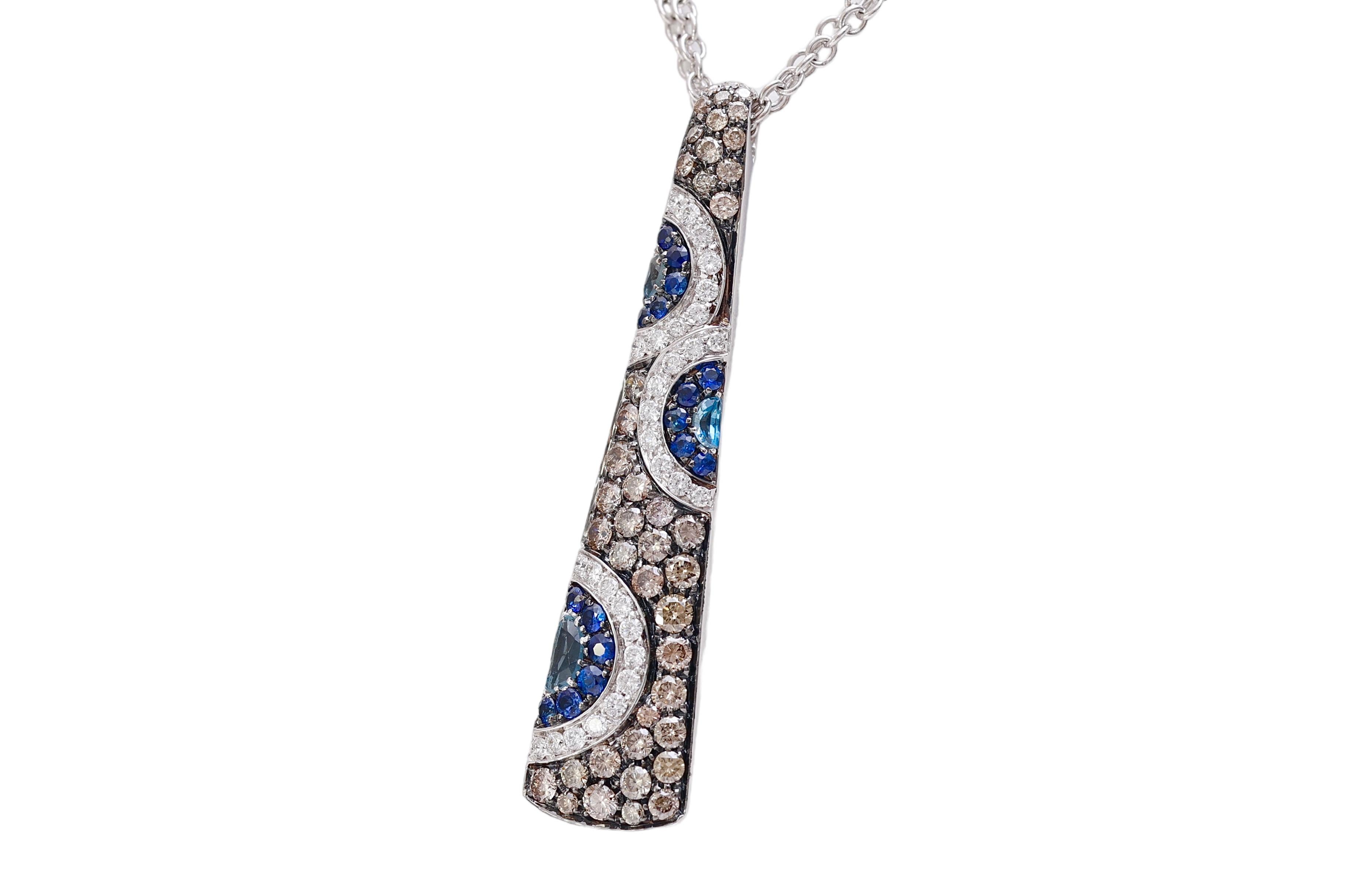 Gorgeous 18 kt. White Gold Pendant/ Necklace With White & Cognac Diamonds and Sapphires  

Diamonds: White brilliant cut diamonds together 0.36 ct. Brilliant cut cognac diamonds together 1.15 ct.

Sapphires: small cut sapphires, together 0.35