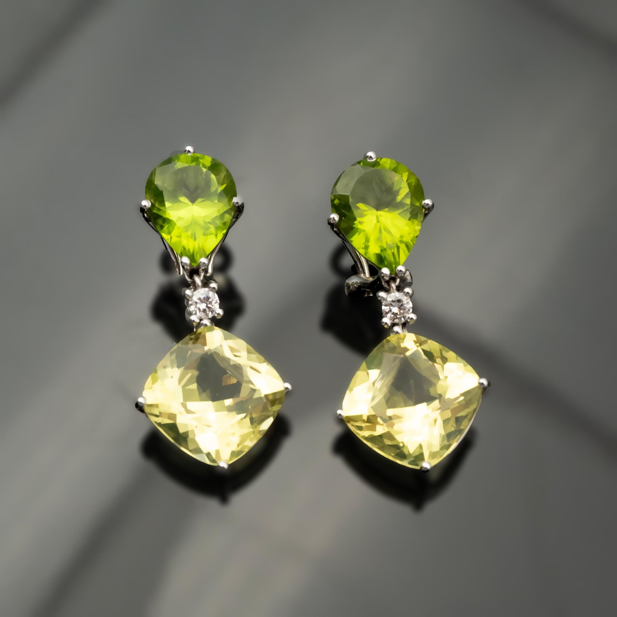 Add a touch of modern elegance to your look with these stylish, high-end clip-on dangle earrings. Crafted from 18-Karat white gold, these earrings feature excellently cut pear-shaped peridots, known for their vibrant lime-green color, paired with
