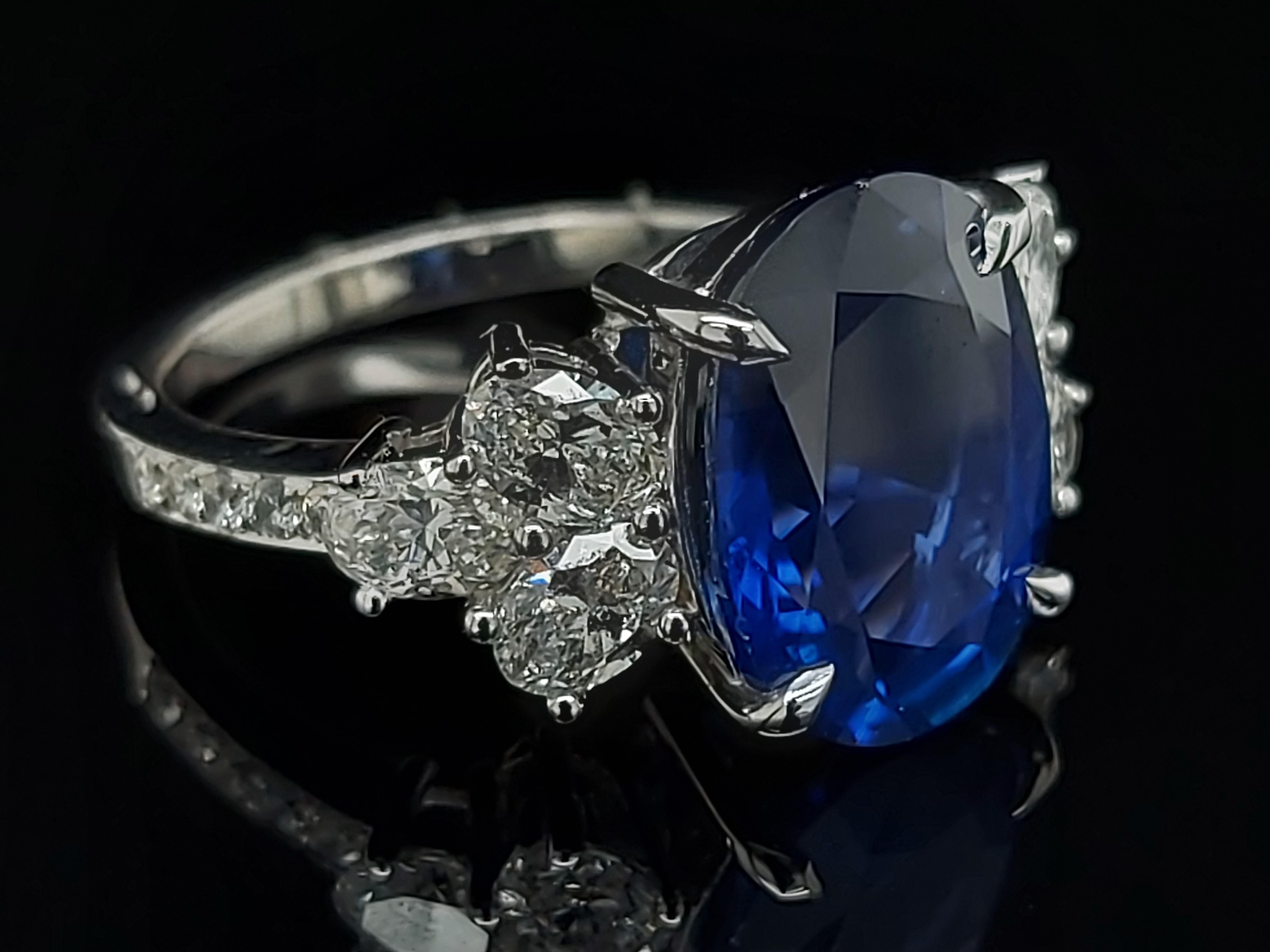 Artisan 18 Karat White Gold Ring Set with a 7 Carat Sapphire and Diamonds