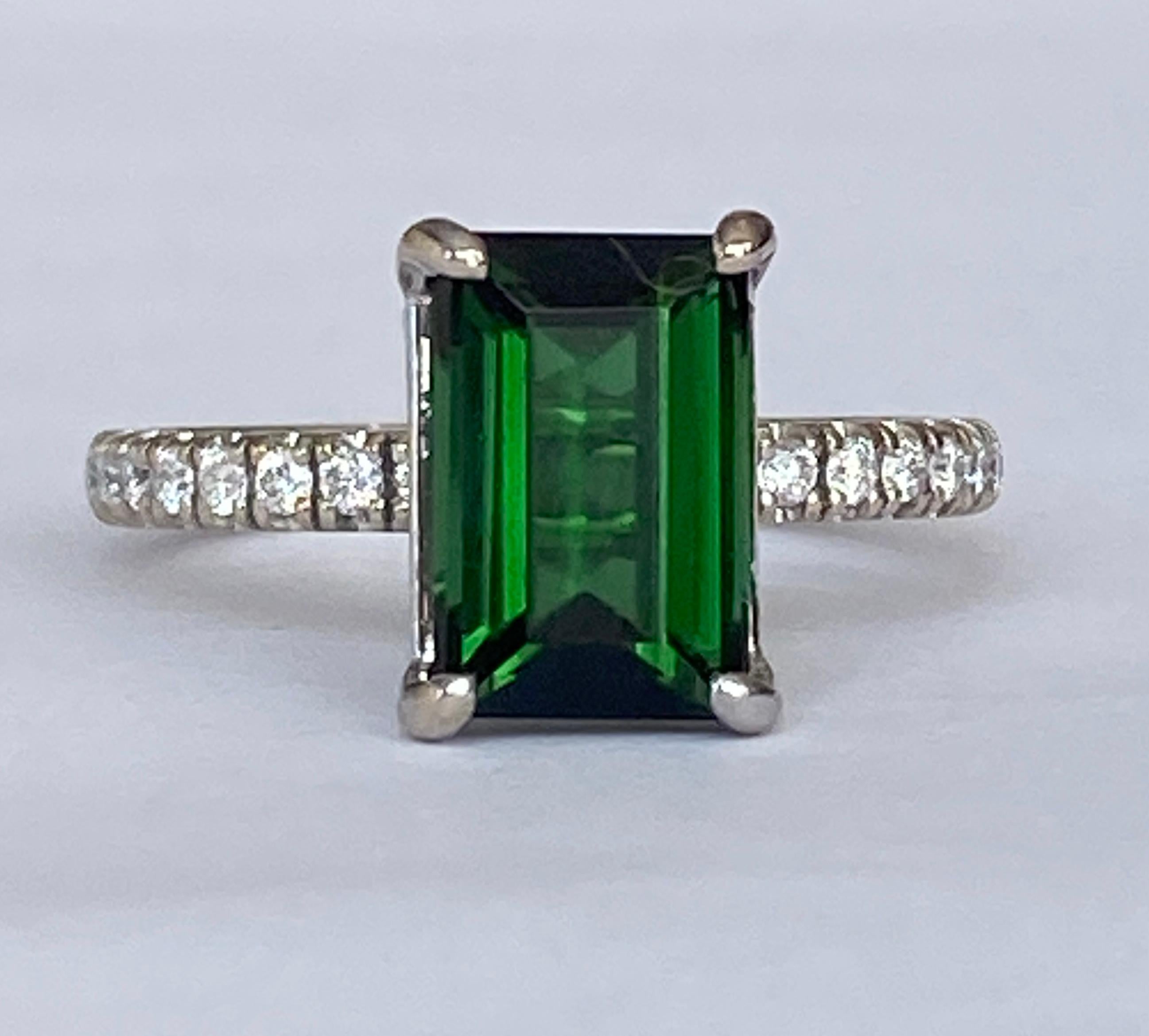 Offered: 18 kt white gold ladies ring with an emerald cut tourmaline (beautiful colour) 2.47 ct, decorated on the side with 16 brilliant cut diamonds, approx. 0.25 ct of G/VS quality.
Quality: 750 (approved)
Head size: 10mm*20mm
Natural tourmaline –
