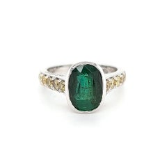 18 Karat White Gold Ring with 3.15 Carat Emerald and Fancy Yellow Diamonds