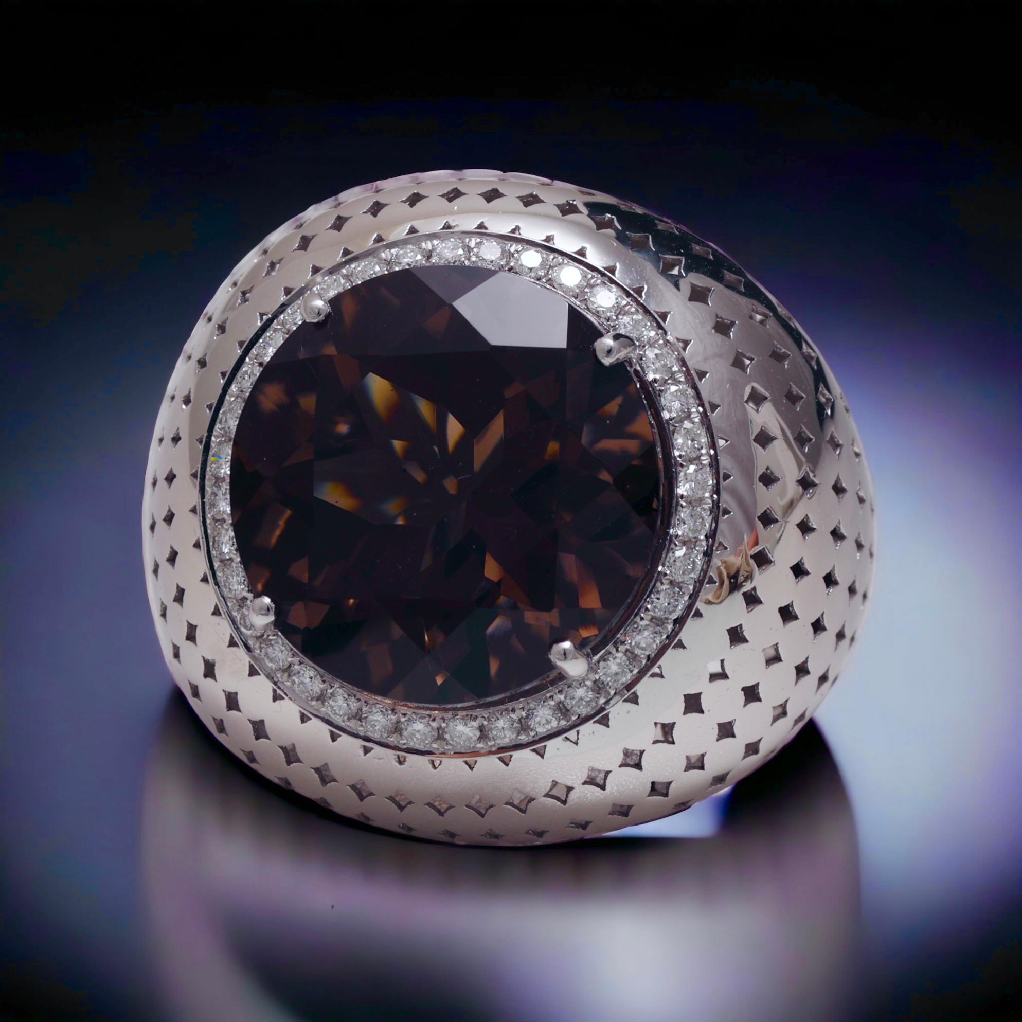 Beautiful 18 kt. White Gold Ring With Smoky Quartz and Diamonds 

Diamonds: brilliant cut diamonds, together approx. 0.40 ct.

Gemstone: Round cut Smoky Quartz approx. 11.21 ct.

Material: 18 kt. white gold

Ring size: 56 EU / 7.5 US ( can be