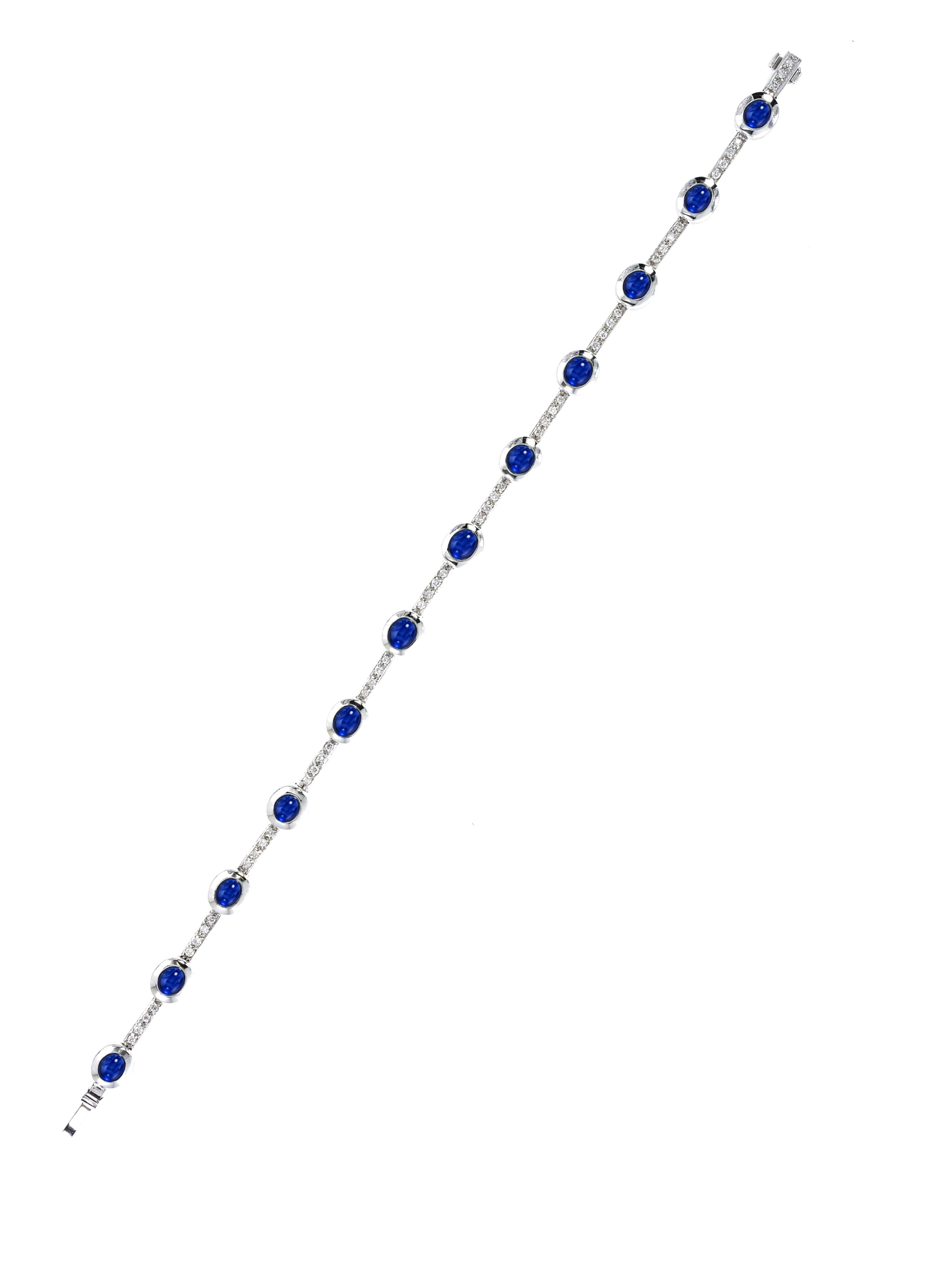 Tennis bracelet available in Rubies or blue Sapphire.
Elegant but extremely versatile, these bracelets may be worn everyday and for every occasion.

The sapphire one weighs gr.21.35 and the cabochon cut stones weigh ct 8.67. Diamonds weigh ct