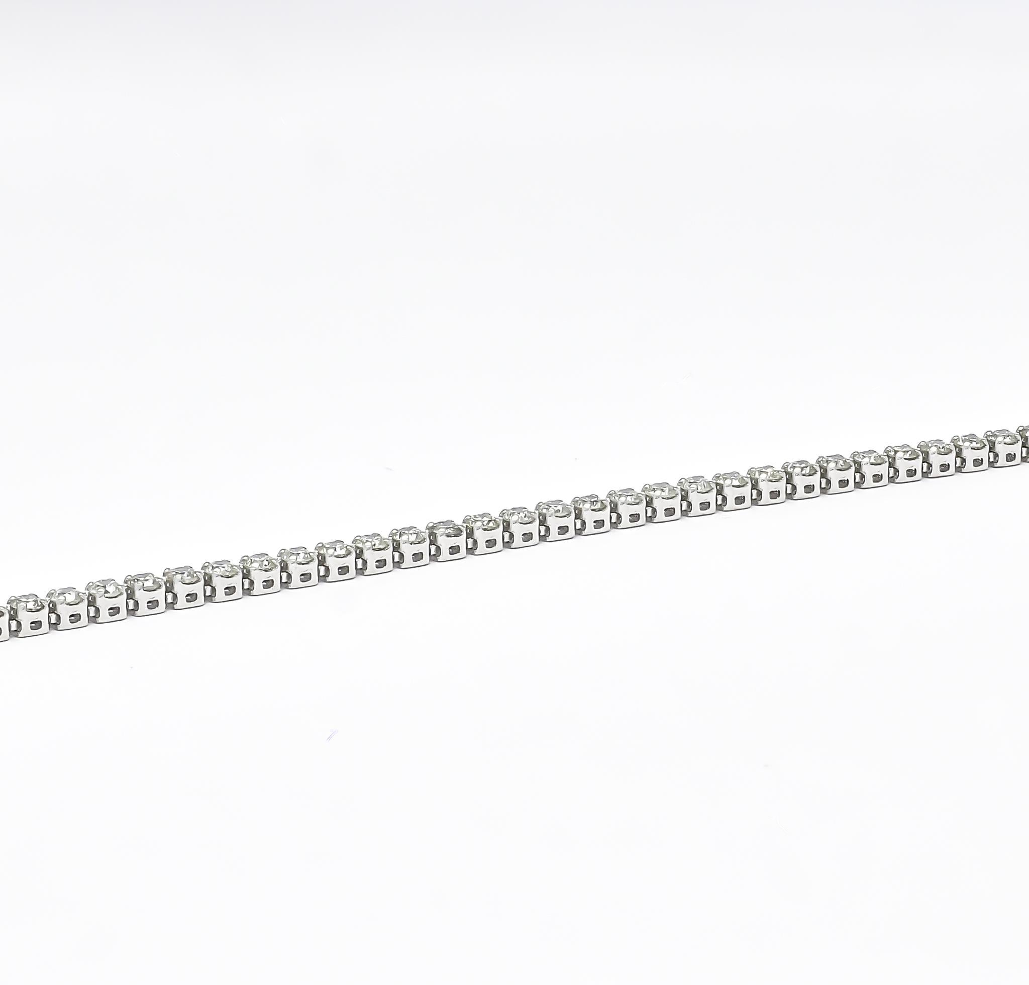 Elevate your style with this luxurious 18Kt white Gold single-row tennis bracelet. Expertly crafted with four prong setting, it features sparkling, brilliant-cut natural diamonds that exude elegance and luxury. The single-row design adds a touch of
