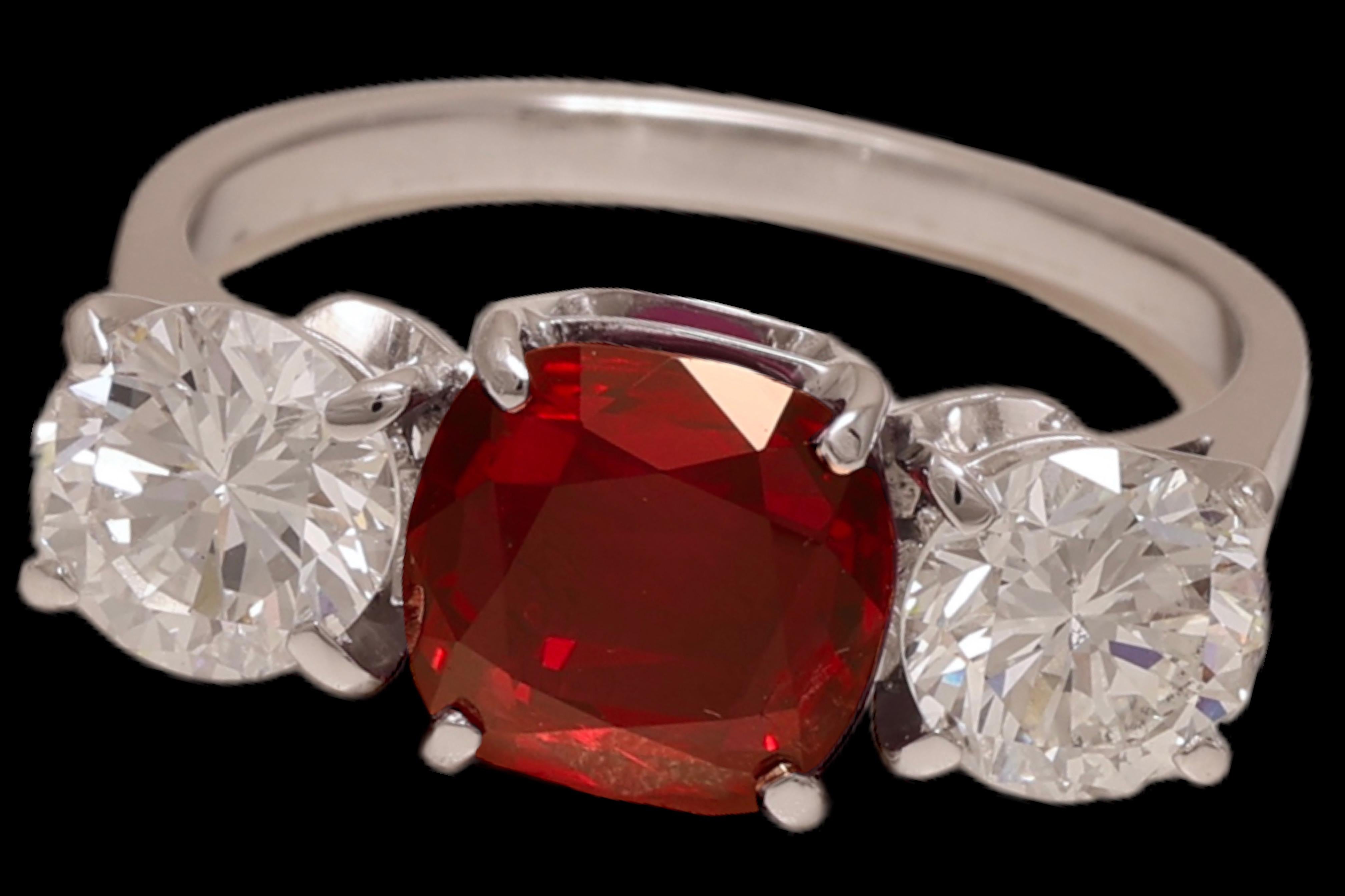 Magnificant 18 kt. White Gold Trilogy Ring with 2.2 ct. Vivid Red Ruby & 1.73 ct. Diamonds

Ruby: Natural brilliant cut / step cut cushion shape, Vivid Red Siam Ruby 2.2 ct.
Comes with a GRS certificate

Diamonds: 2 round brilliant cut diamonds,