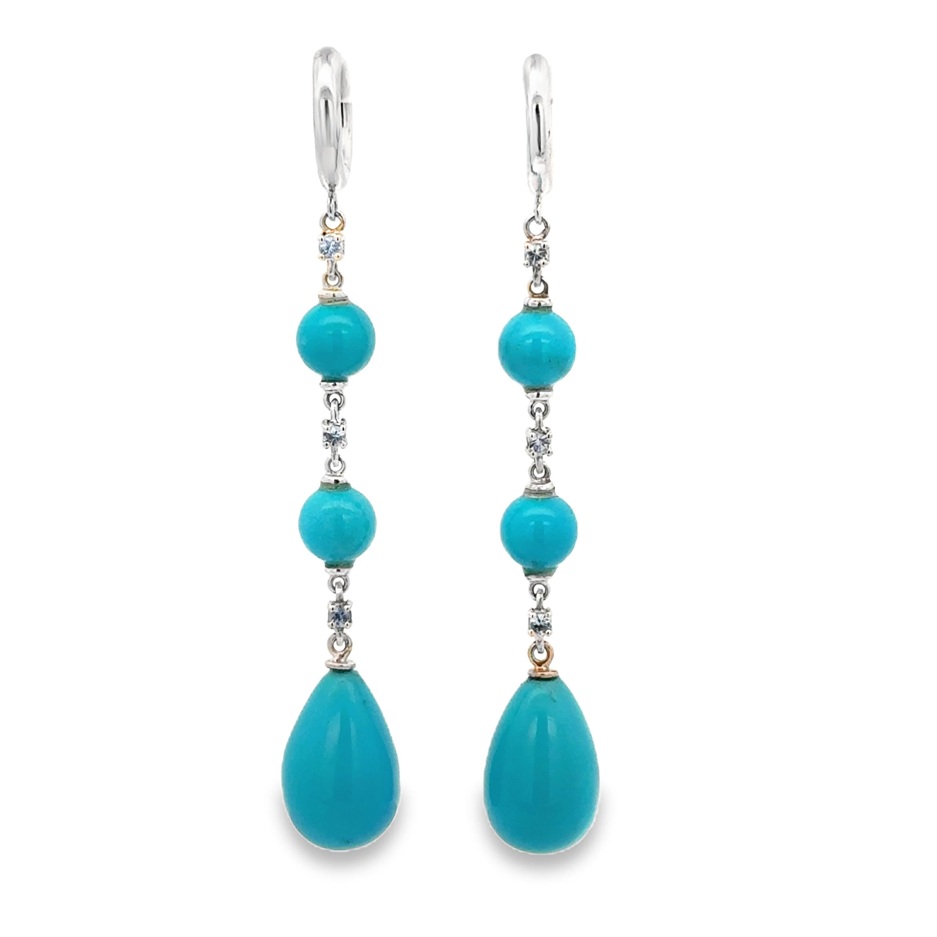 Elevate your elegance with the 18 Karat White Gold Turquoise and  Sapphires Garavelli Hanging Earrings. These exquisite earrings, crafted with precision and style, are a testament to beauty and sophistication.
Each earring is a masterpiece in