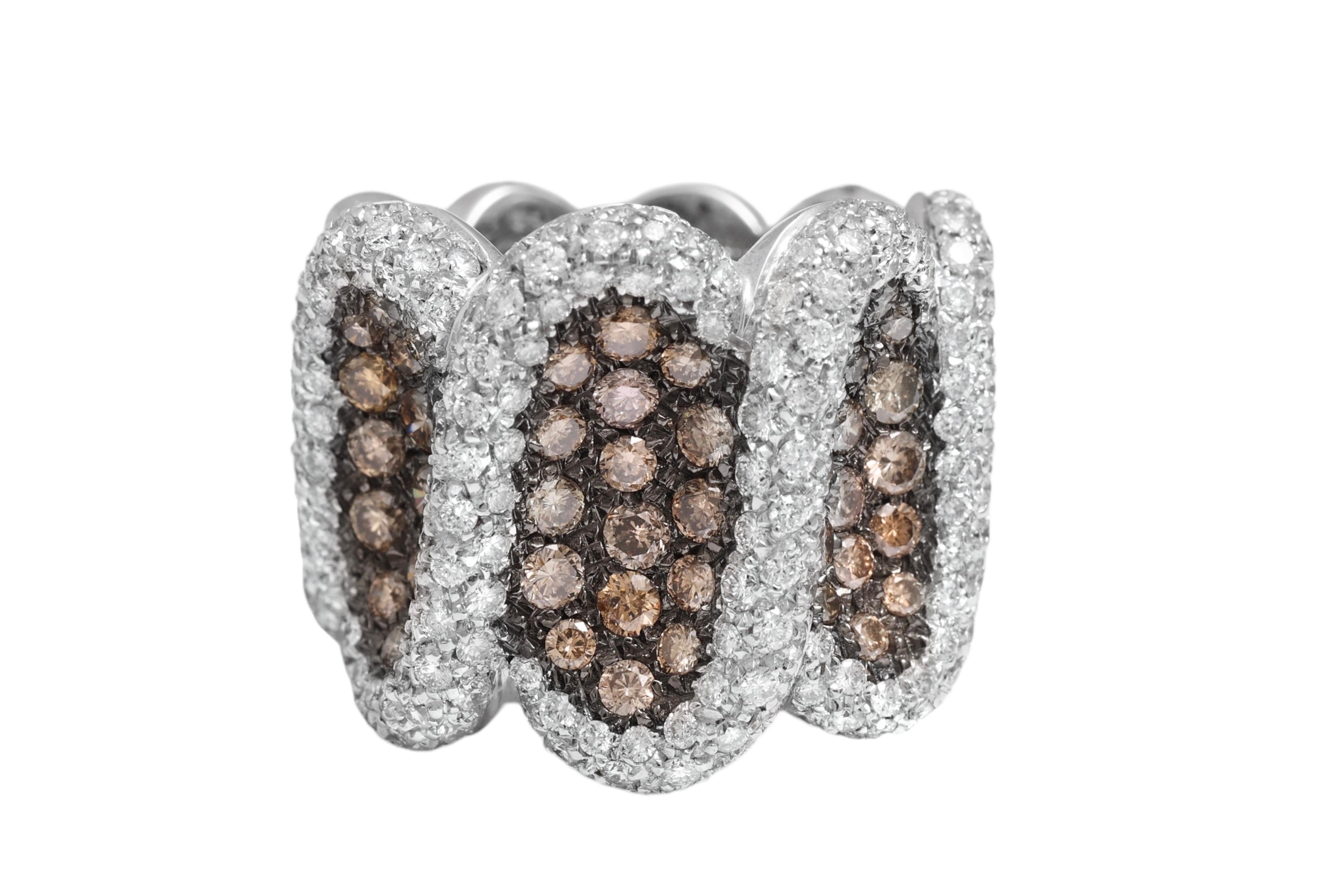 18 Kt White Gold, White & Cognac Color Natural Diamonds Ring

MATERIAL: 18 kt solid white gold

DIAMONDS: white brilliant cut diamonds together ca. 2.5 cts + cognac diamonds together ca. 1.68 cts

WEIGHT: 22.8 gr 

SIZE : 54 EU ( can be resized for