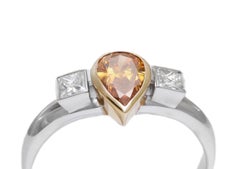 18 Kt White & Yellow Cognac Pear Shape & Princess Cut Diamond Ring