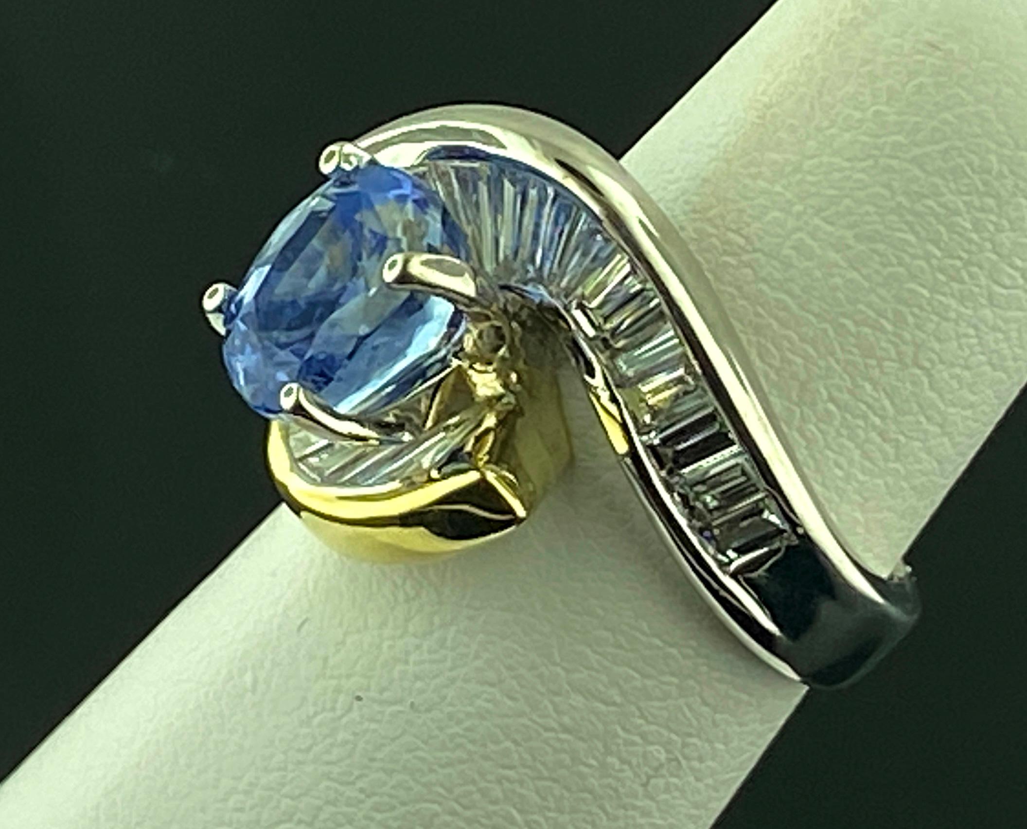 Oval Cut 18 KT White & Yellow Gold Ring with a 4.03 Ct Blue Sapphire and 2.0 Cts Diamonds
