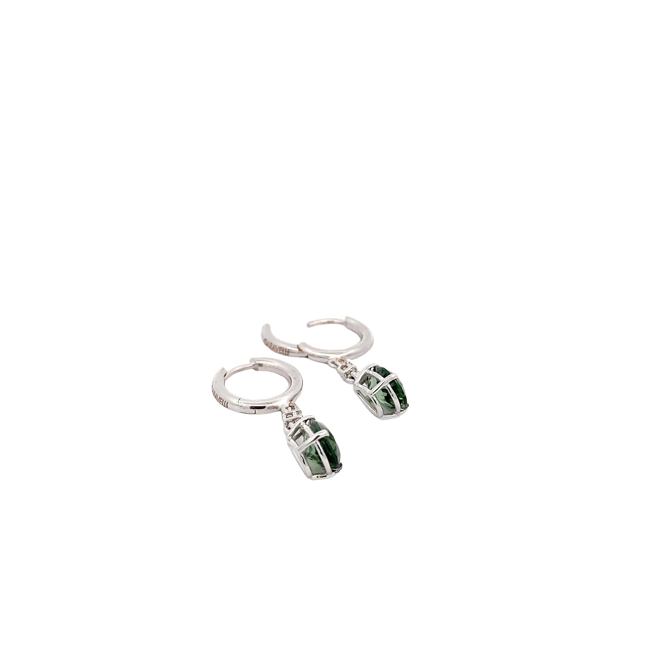 Elevate your elegance with the 18 Karat White Gold Green Tourmaline and White Diamonds Garavelli Hanging Earrings. These exquisite earrings, crafted with precision and style, are a testament to beauty and sophistication.
Each earring is a