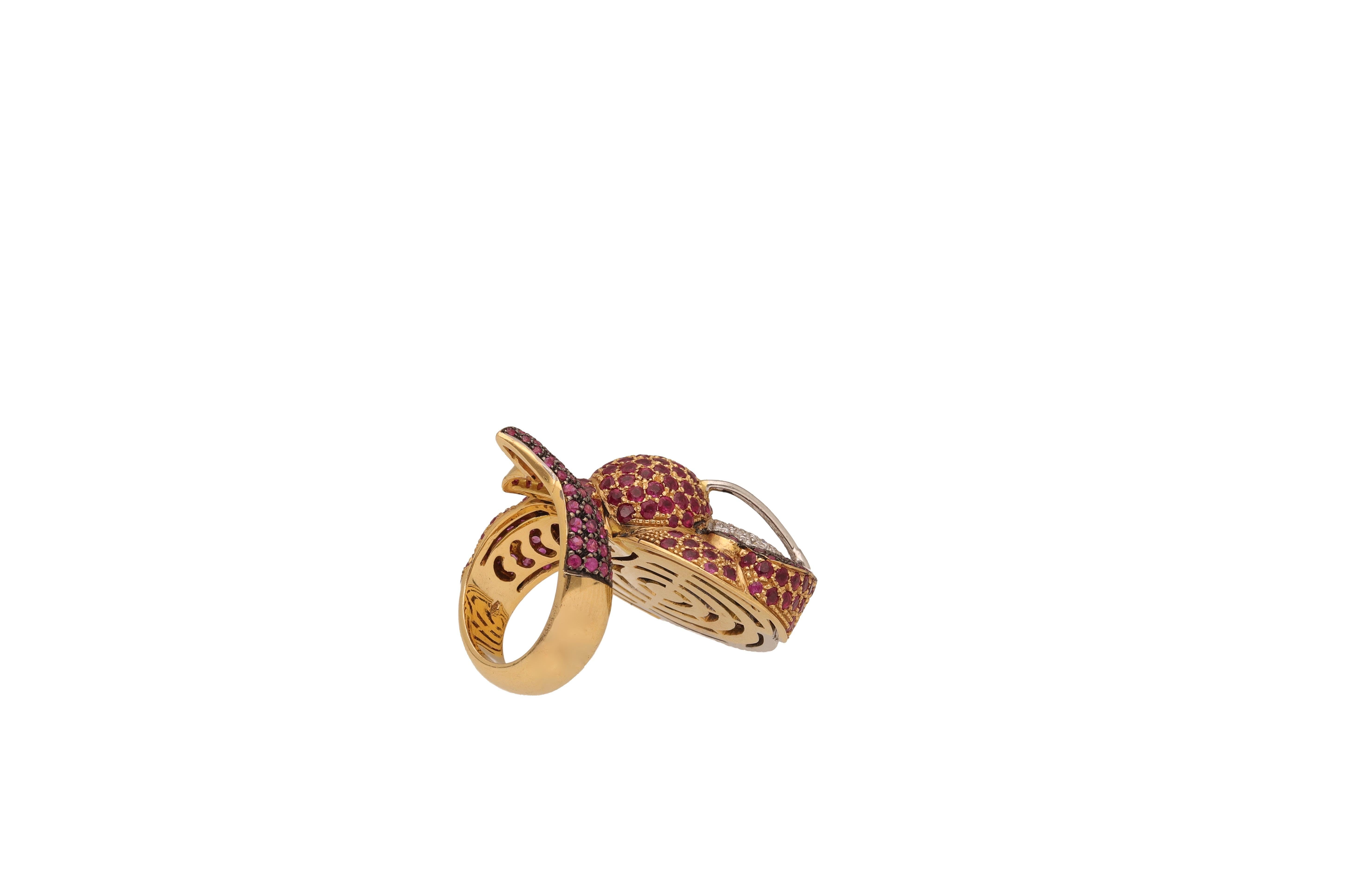 18 kt. yellow and white gold cocktail ring with 4.30 ct. of round-cut diamonds, 3.20 of round-cut rubies and 1.50 ct. of round-cut pink sapphires.
The ring is designed as a lobster.
This ring is entirely Made in Italy.
1990 ca. 
Ring size 7
Weight