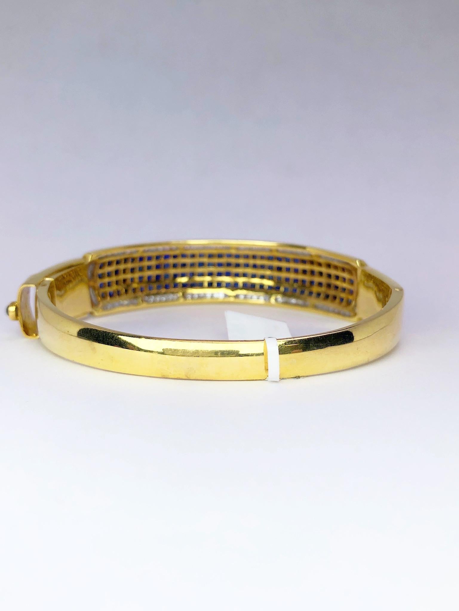 Women's or Men's 18 Karat Gold, 16.26 Carat Invisibly Set Sapphire and Diamond Bangle Bracelet For Sale