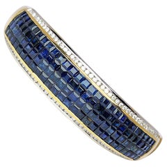 18 Karat Gold, 16.26 Carat Invisibly Set Sapphire and Diamond Bangle Bracelet