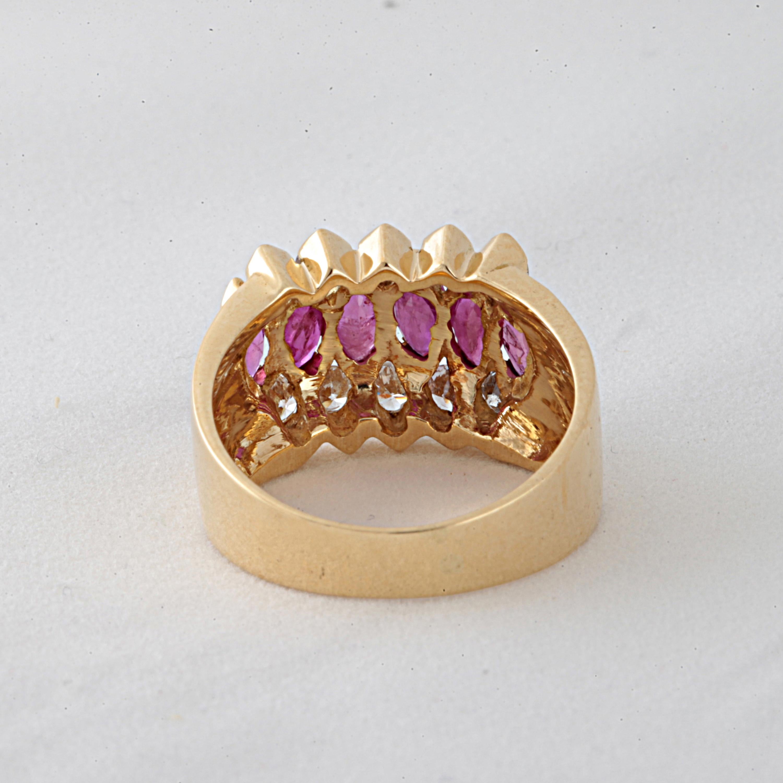 18 Kt Yellow Gold Band Ring with 6 Navette Rubies and 10 Round Brilliant Diamonds
The 6 Rubies are Marquise cut, trasparent, omogeneous with very nice matching colour, purplish red with an estimated unit weight of: 0. 35cts ( except 1 smaller