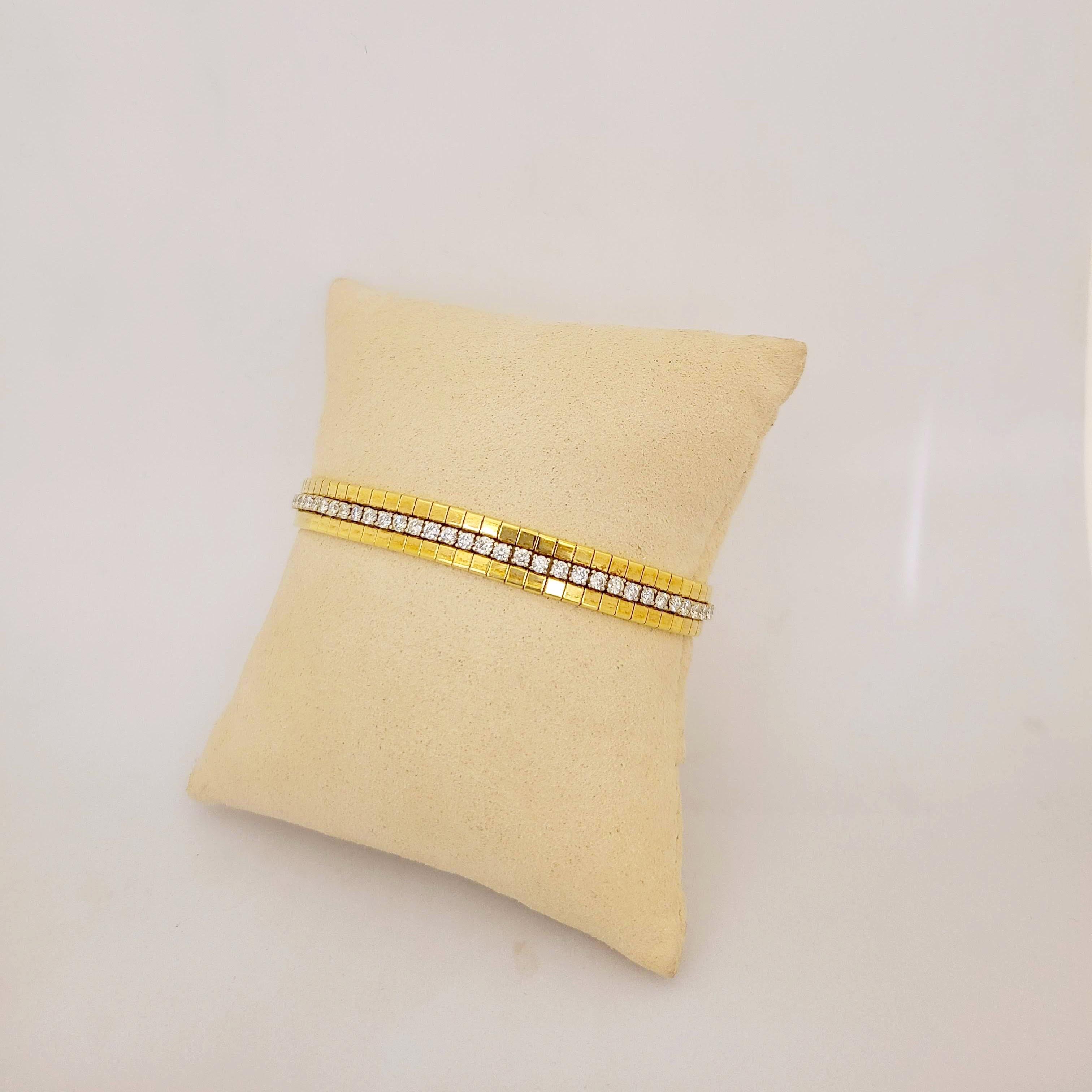 18 karat gold bracelet. This bracelet is set with a single row of round Brilliant Diamonds in 4 prong white gold settings, down the center. The outer 2 rows are made up of yellow gold square sections.
The bracelet measures 7