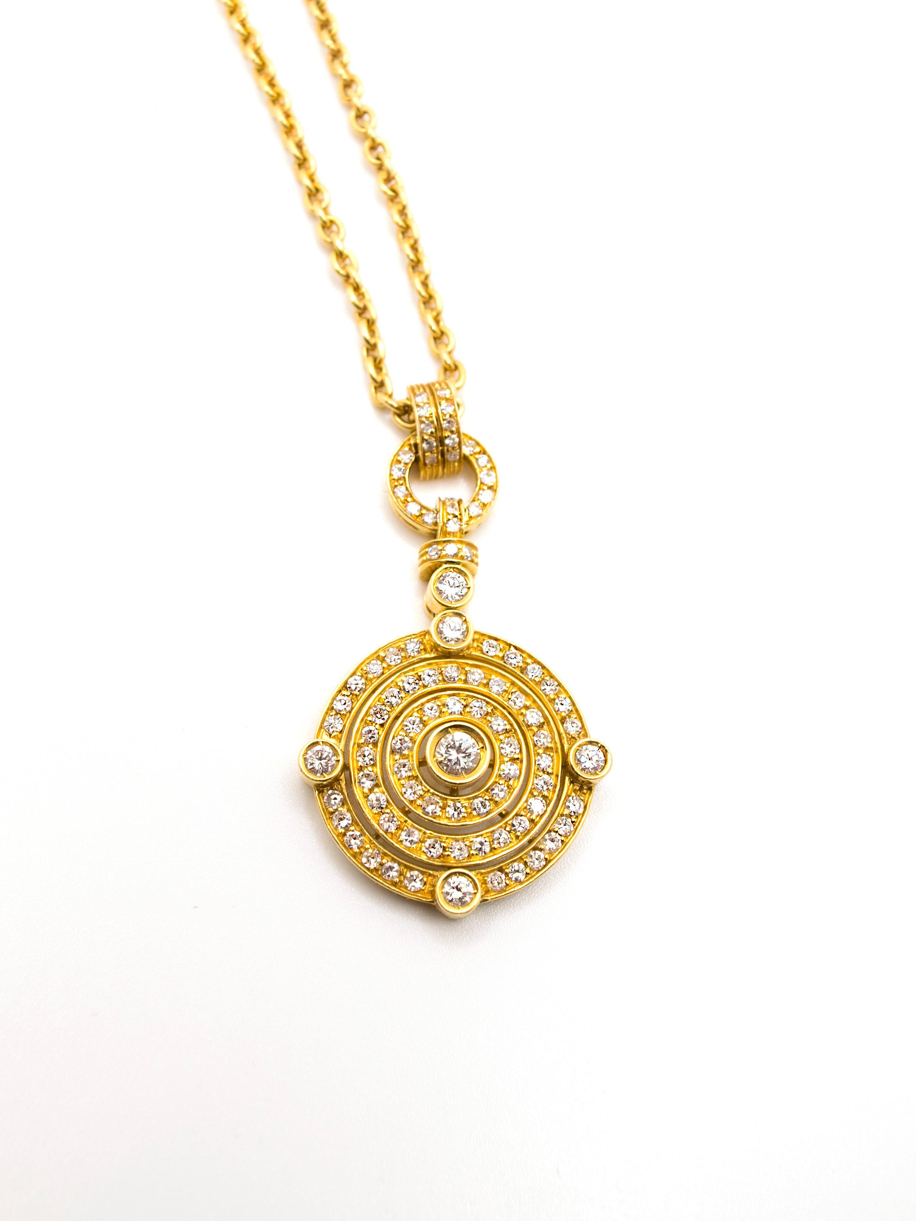 Art Decò inspired necklace is made in 18 Kt yellow gold weighing in total gr. 21.55.
The charm is embellished with six bigger diamonds ( Ct 0.50 circa ) and other smaller ones all over the surface.
The charm has a diameter of cm 2.35 and a length of