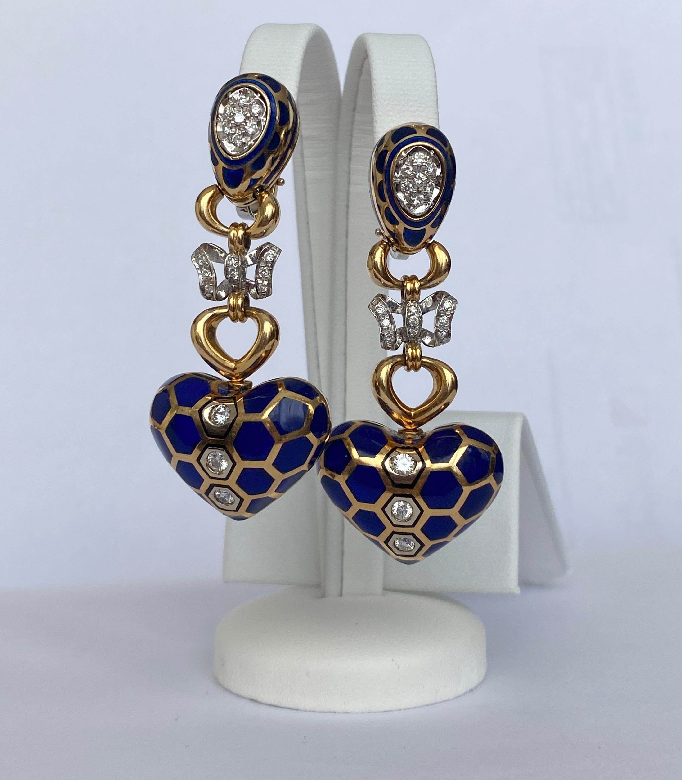 Offered are beautiful 18 kt gold and enamel long earrings. A unique property! Enamel is particularly striking because of the play of the colors, a blue with gold. The earrings are decorated with 38 brilliant cut diamonds, approx. 1.40 ct, of quality